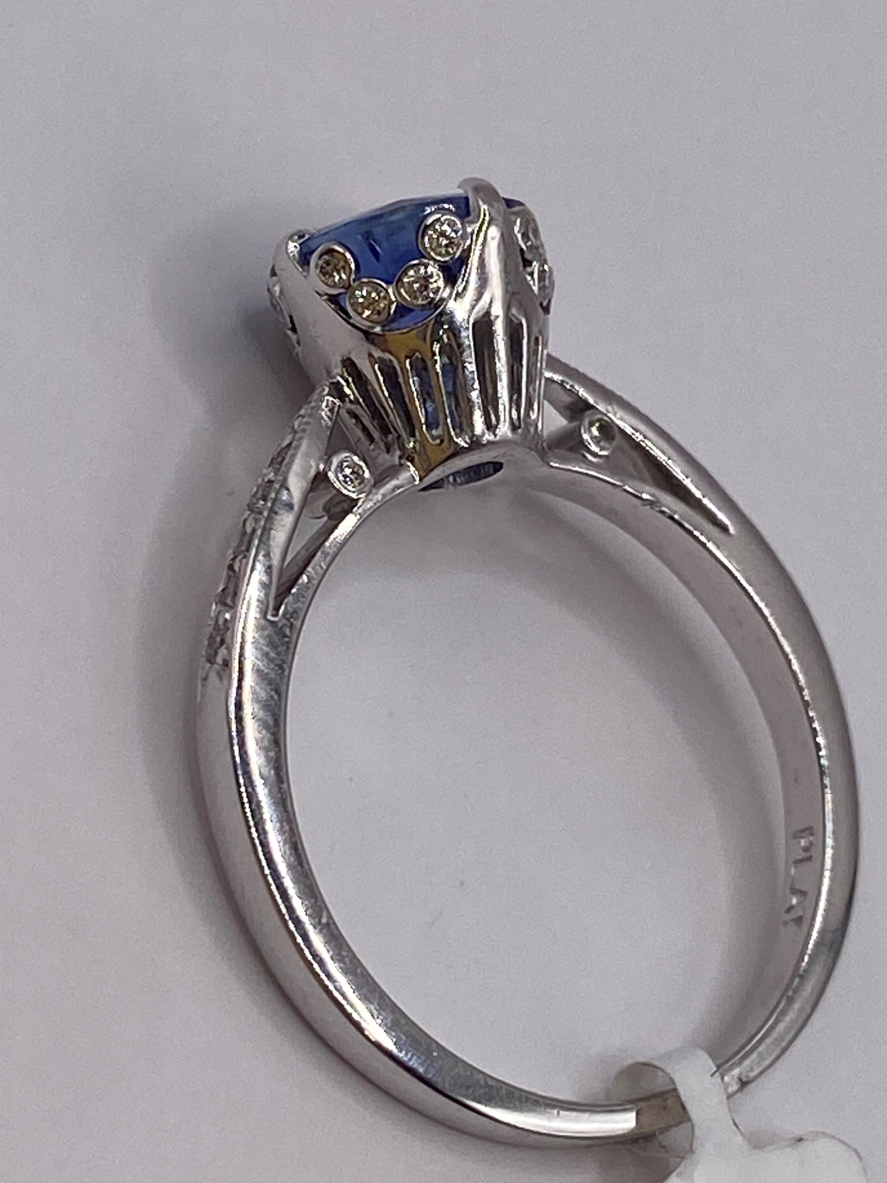 Platinum
Finger Size: 6.5
(ring is size 6.5, but is sizable upon request)

Number of Sapphires: 1
Carat Weight: 1.38ct
Stone Size: 7.20mm

Number of Round Diamonds: 31
Carat Weight: 0.26ctw