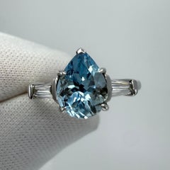 1.64ct Pear Cut Aquamarine And Baguette Cut Diamond Platinum Three Stone Ring