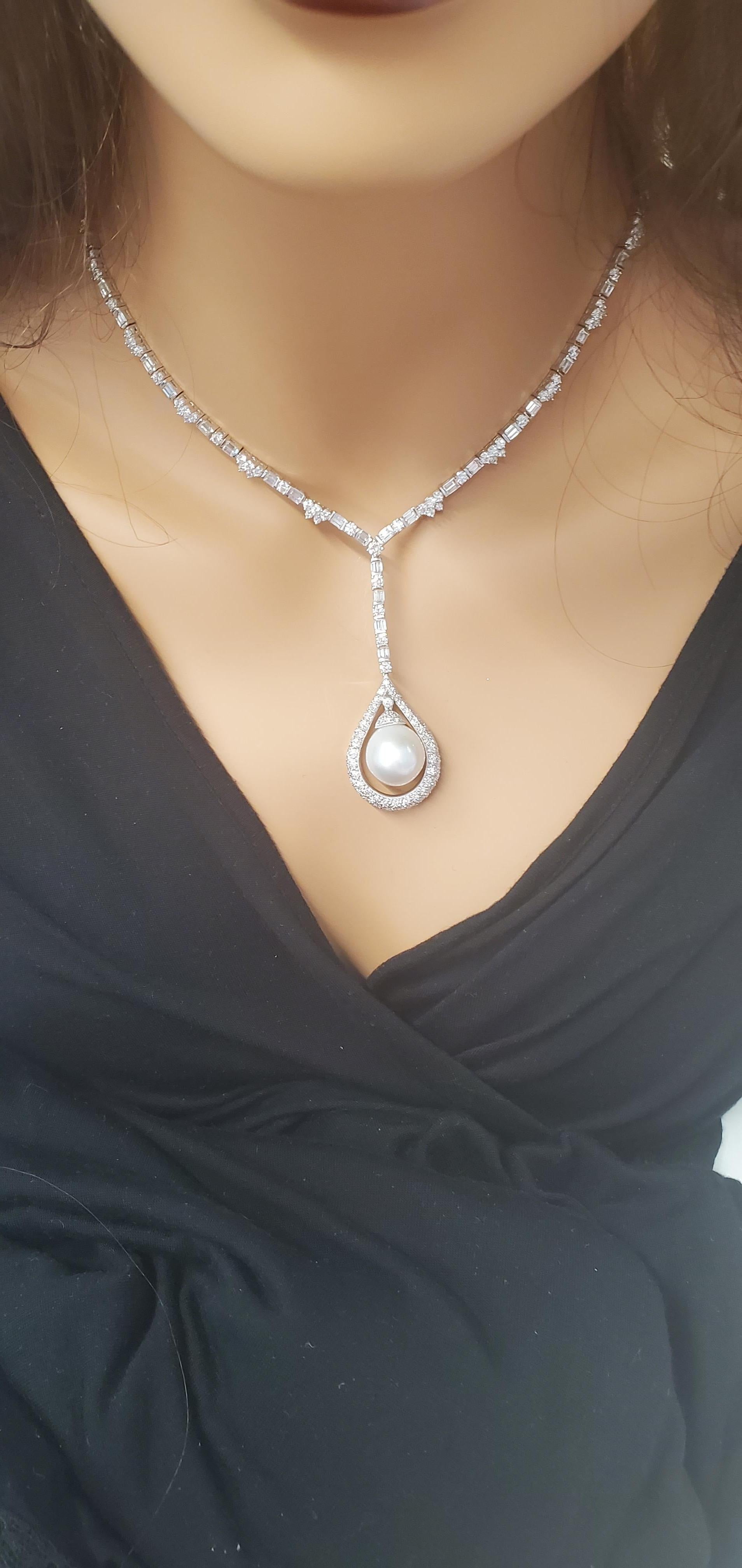 Nothing says elegance like the shimmering beauty of pearls! This gorgeous, brightly polished 18k white gold necklace features a white cultured pearl in the center, showcasing a high luster and pastel overtones complemented by a total of 241 round