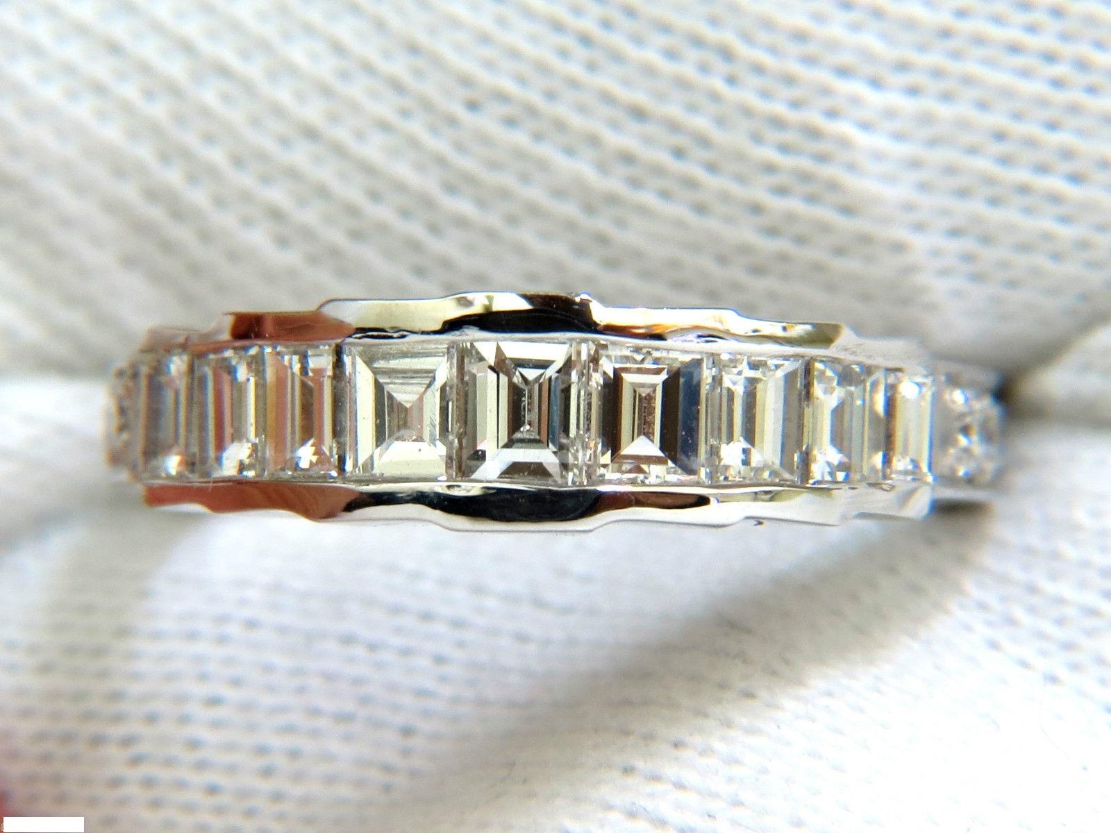 1.65ct. Baguette cuts channel band.

All Diamonds: G-color, Vs-1 clarity.

Full cut Baguettes and rounds on shoulders.

gorgeous side pave set diamonds

Ring: 5.4mm wide

Depth: 3.7mm

3.8 grams

solid 14kt. white gold.

Current size: 7

$4500