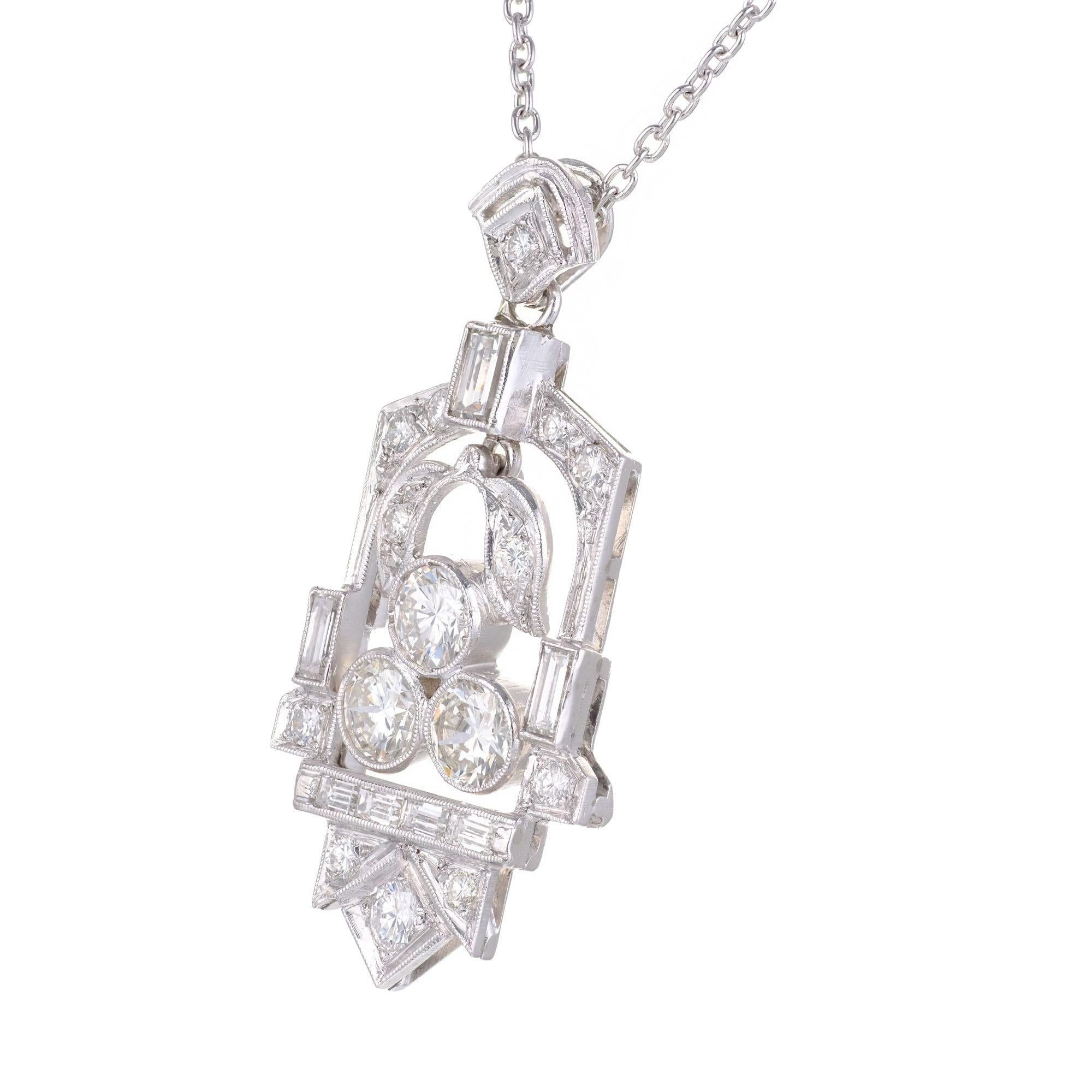 Art Deco 1930's diamond pendant necklace. 22 transitioanl and baguette cut diamonds on a 16 inch chain. 

12 transitional cut diamonds, H-I VS-SI approx. .35cts
7 straight cut baguettes, H VA approx. .30cts
3 transitional cut diamonds, H-I VS-SI
