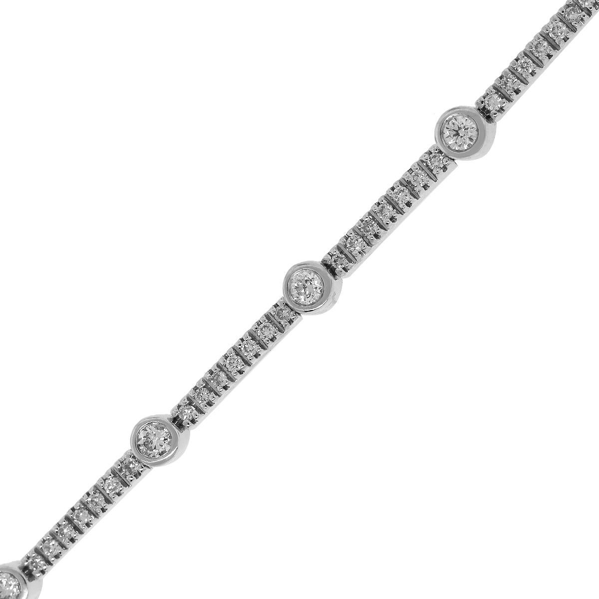 Material: 18k White Gold
Diamond Details: Approximately 1.65ctw round brilliant bezel set diamonds. Diamonds are G/H in color and VS in clarity.
Measurements: 7.5″
Clasp: Tongue in box clasp with safety latch
Total Weight: 16.10g (10.3dwt)
SKU: