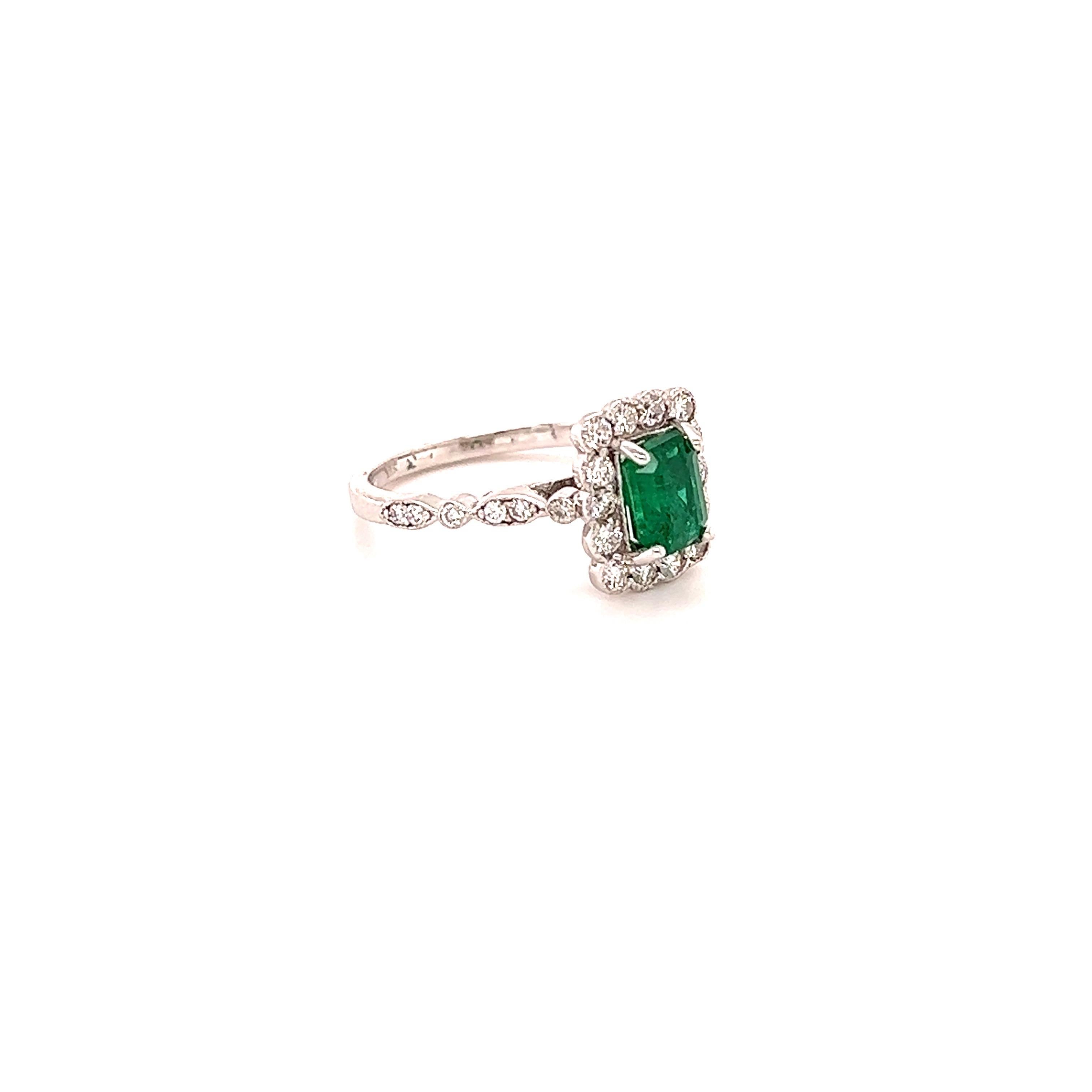 A beautiful and classic setting holding a Natural Emerald Cut Emerald that weighs 1.15 carats. Surrounded by Natural Round Cut Diamonds that weigh 0.50 carats with a clarity & color of SI1-F  The total carat weight of the ring is 1.65 carats.

The