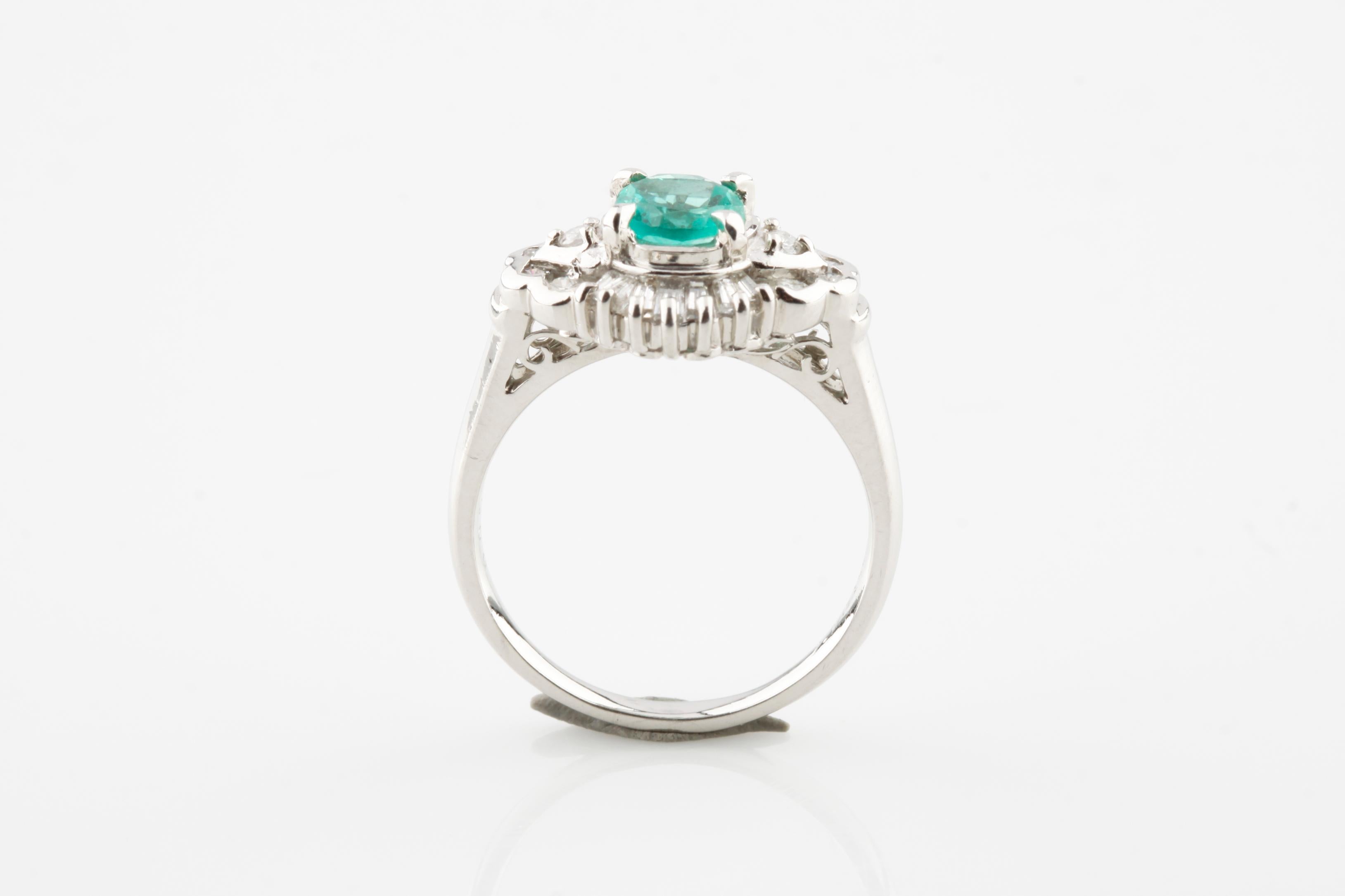 Modern 1.65 Carat Emerald Solitaire Platinum Ring with Diamond Accents For Sale