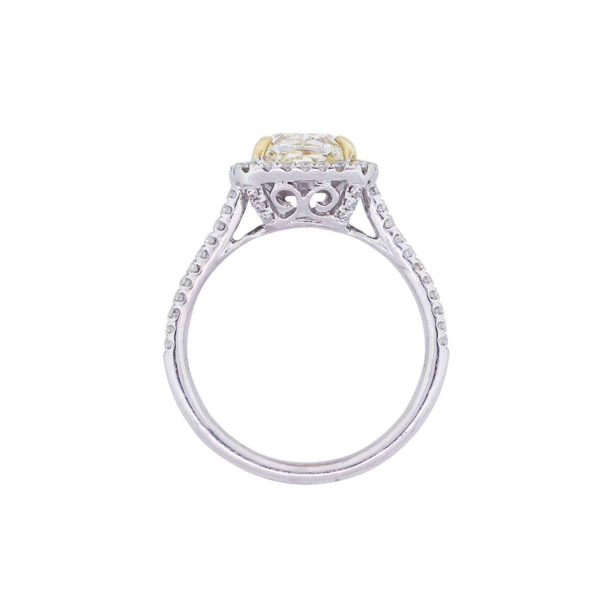 Material: 14k White Gold
Center Diamond Details: Cushion cut fancy yellow diamond approximately 1.65ct
Adjacent Diamond Details: Approximately 0.48ctw of round brilliant diamonds. Diamonds are G/H in color and SI in clarity
Ring Size: 6.50
Ring