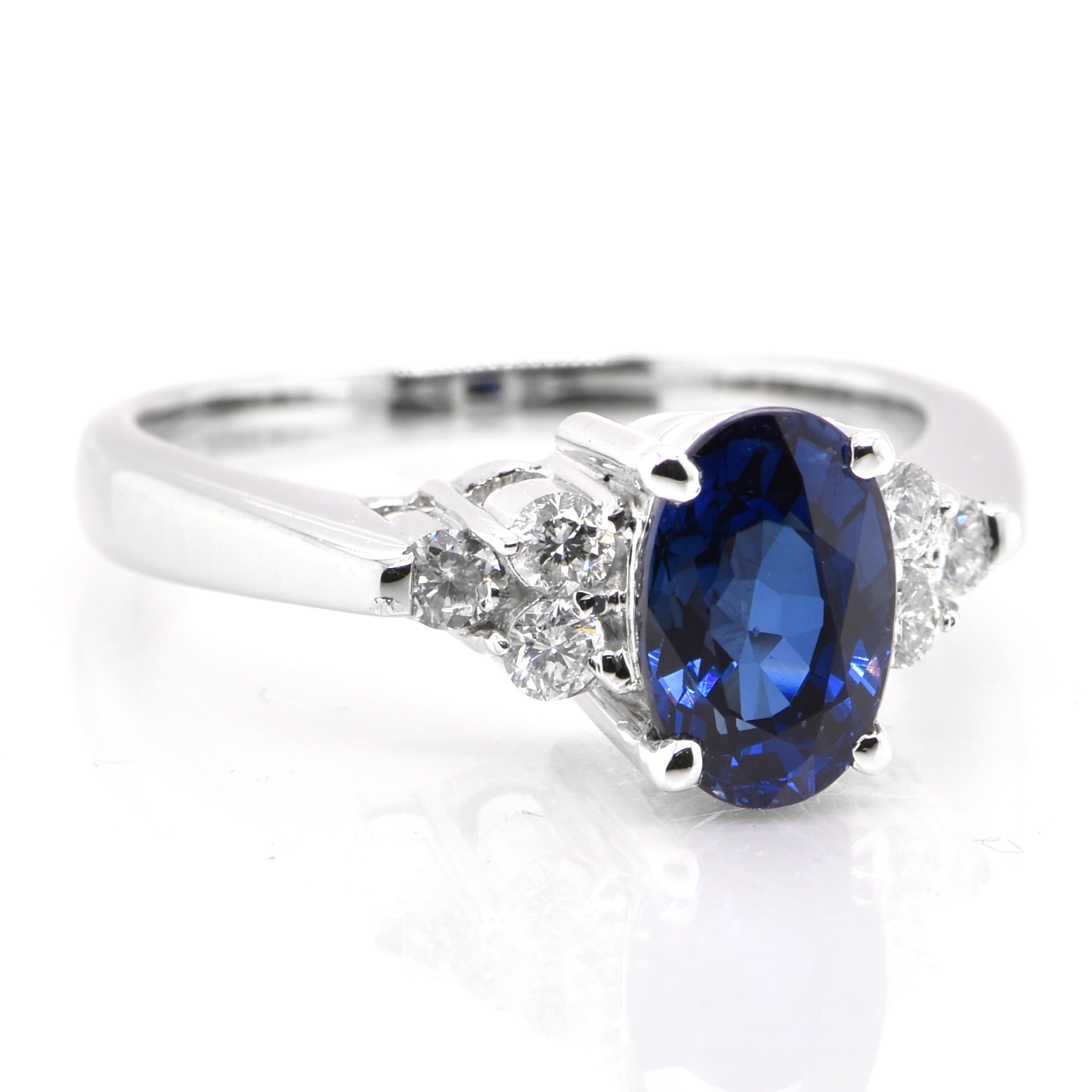 Modern 1.65 Carat Natural Blue Sapphire and Diamond Ring set in Platinum For Sale