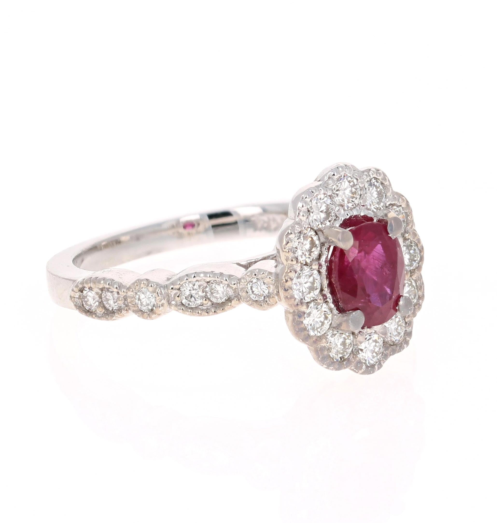 This ring has a 1.07 Carat Oval Cut Burmese Ruby that is set in the center and is surrounded by 24 Round Cut Diamonds that weigh 0.58 carats.   The Clarity and Color of the Diamonds is VS2-H.  The total carat weight of the ring is 1.65 carats.

The