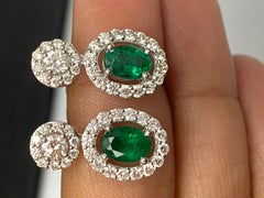1.65 Carat of Oval cut Emerald and Diamond Drop Earrings in 18K White Gold