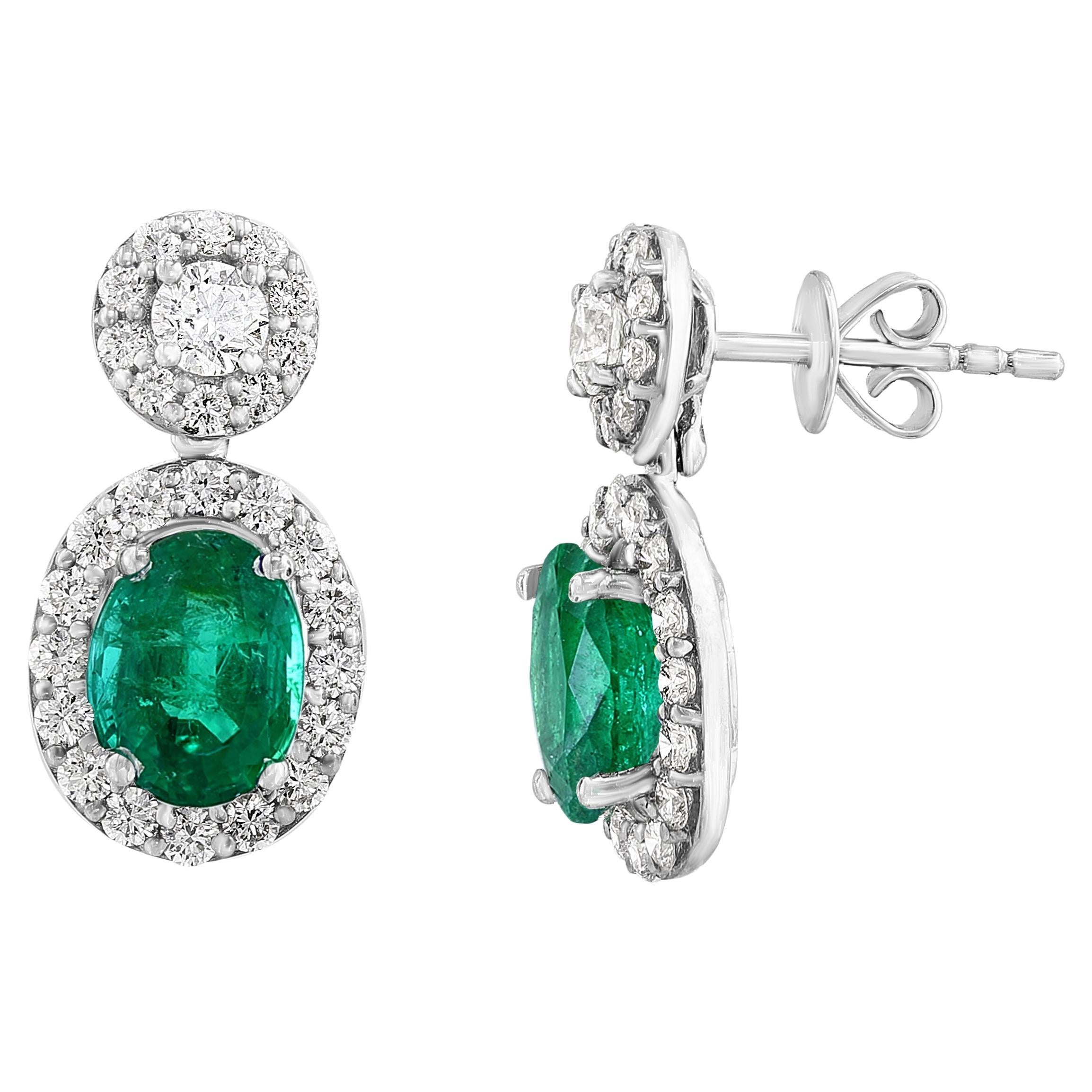 1.65 Carat of Oval cut Emerald and Diamond Drop Earrings in 18K White Gold For Sale