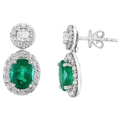 1.65 Carat of Oval cut Emerald and Diamond Drop Earrings in 18K White Gold