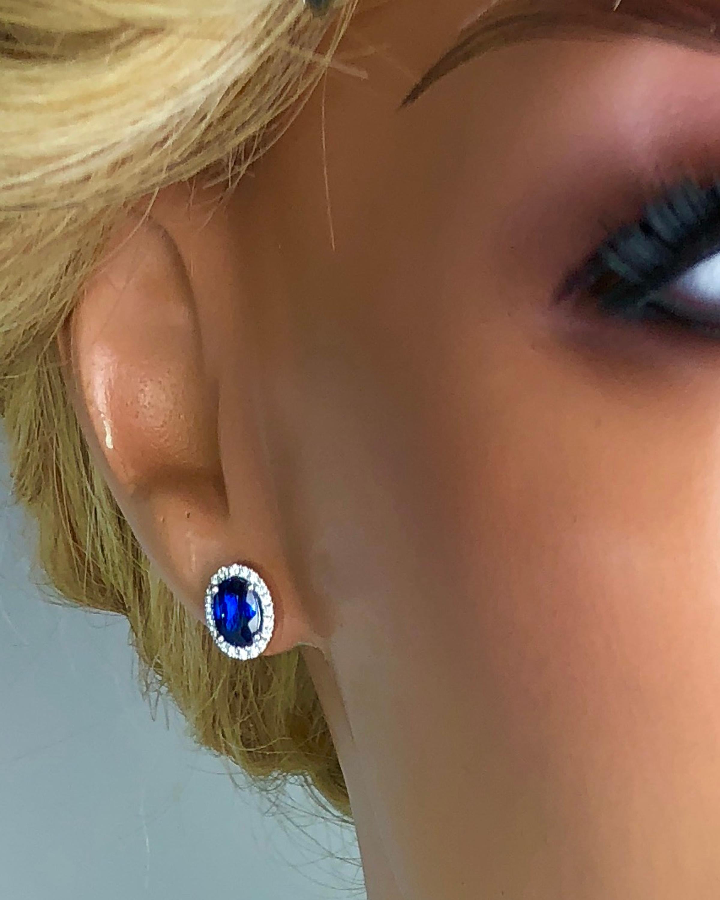 Women's 1.65 Carat Oval Cut Blue Sapphire Earrings with Diamond Halo in 18k White Gold