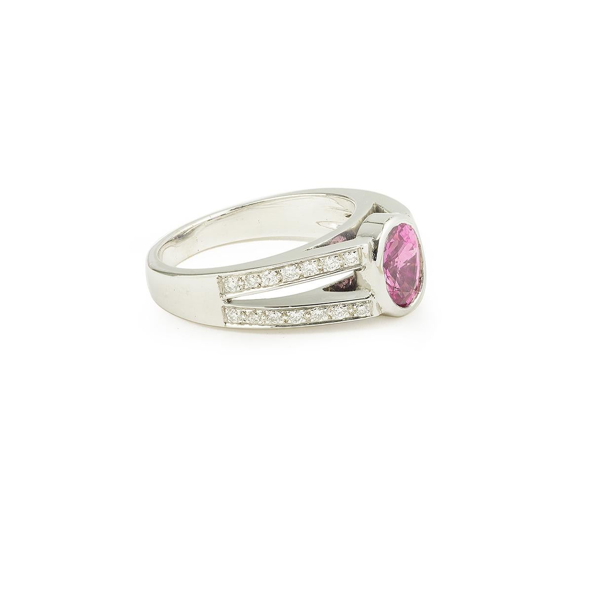 Beautiful ring set with a central oval pink sapphire with diamonds on each sides.
18 carat white gold 750 / 1000th  (eagles' head hallmark)

Weight of pink sapphire: 1.65 carats

Color: intense pink
Features: Very slightly heated
Provenance: