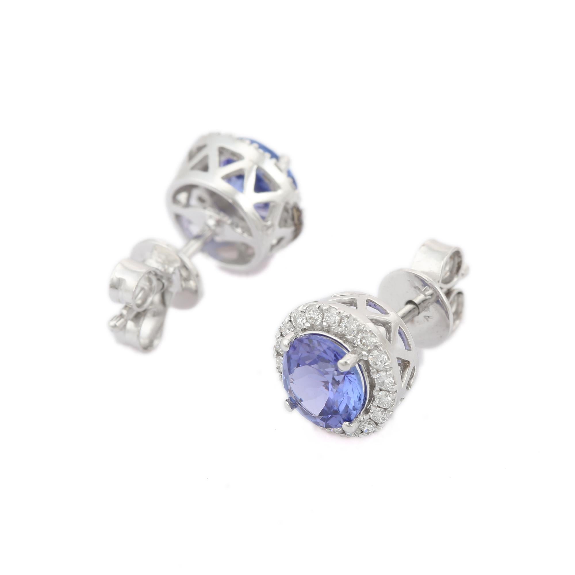 Round Cut 1.65 Carat Round Shaped Tanzanite with Diamonds Stud Earrings in 18K White Gold For Sale