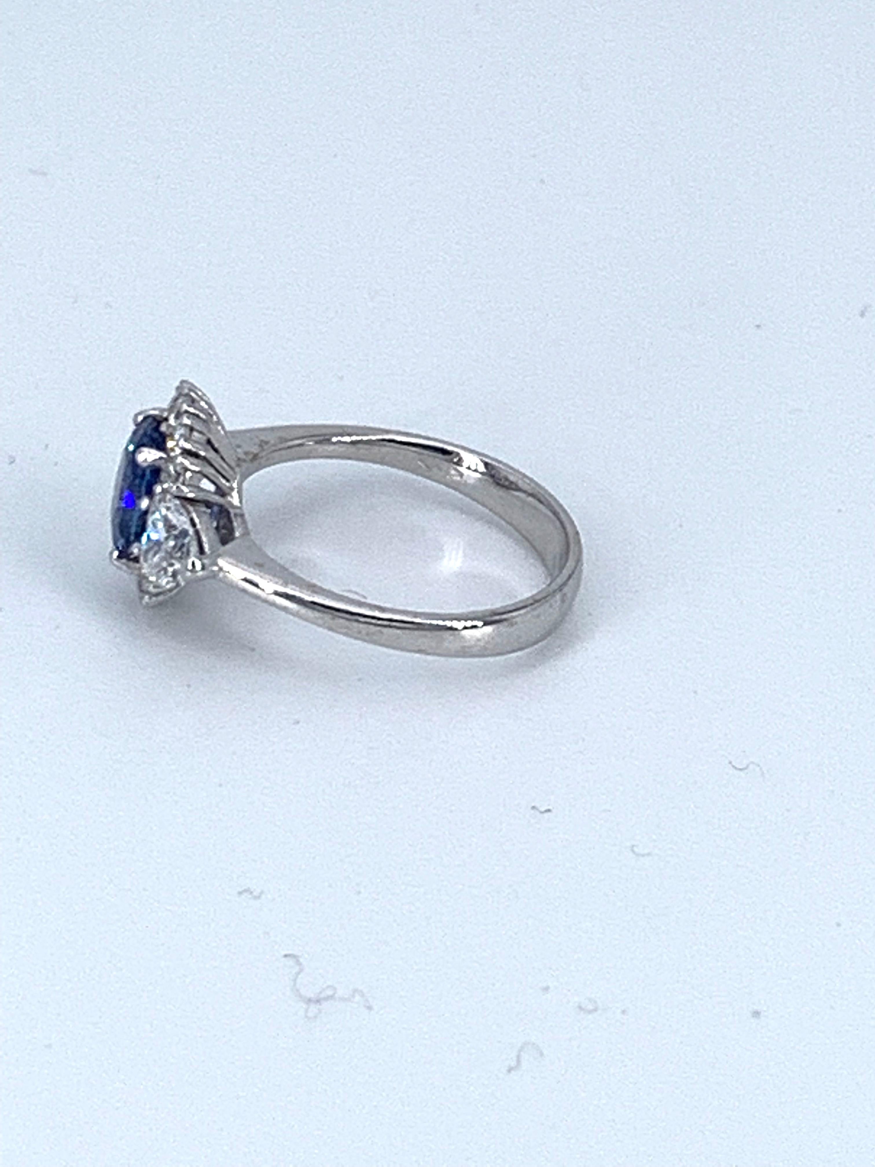 Round Cut Contemporary 1.65 Carat Sapphire & 1.25 Carat Engagement Diamond Ring For Sale