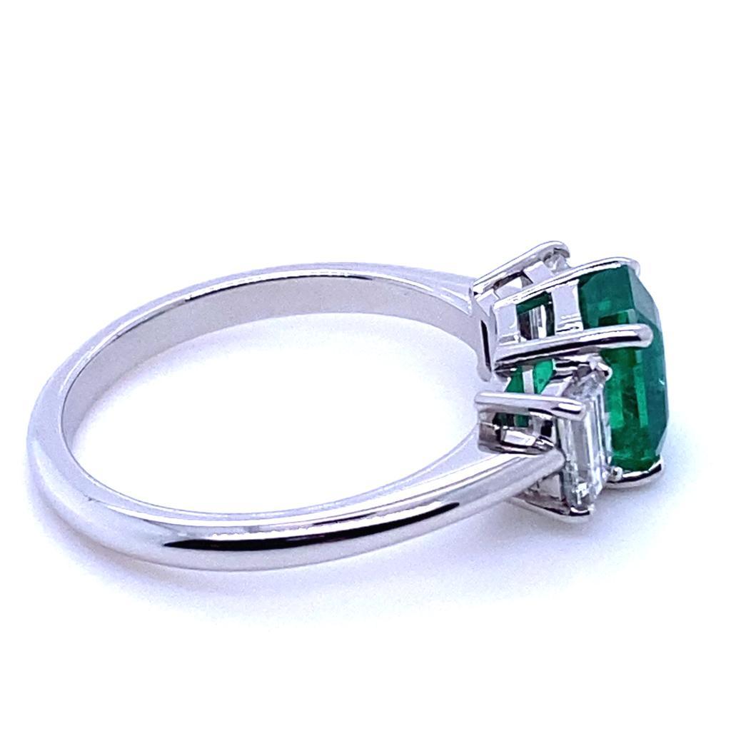 Modern 1.65 Carat Zambian Emerald and Diamond Three Stone Platinum Engagement Ring For Sale
