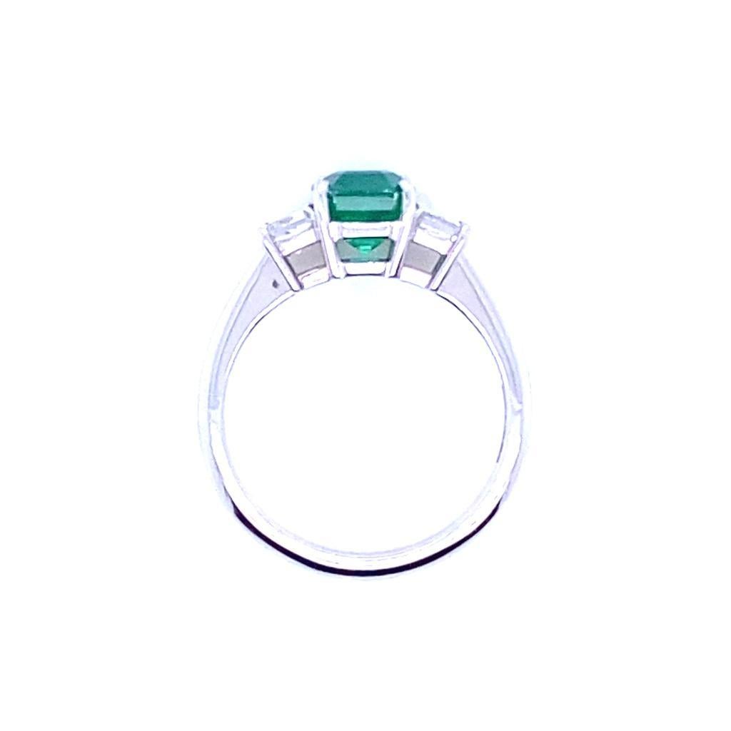 1.65 Carat Zambian Emerald and Diamond Three Stone Platinum Engagement Ring In Excellent Condition For Sale In London, GB