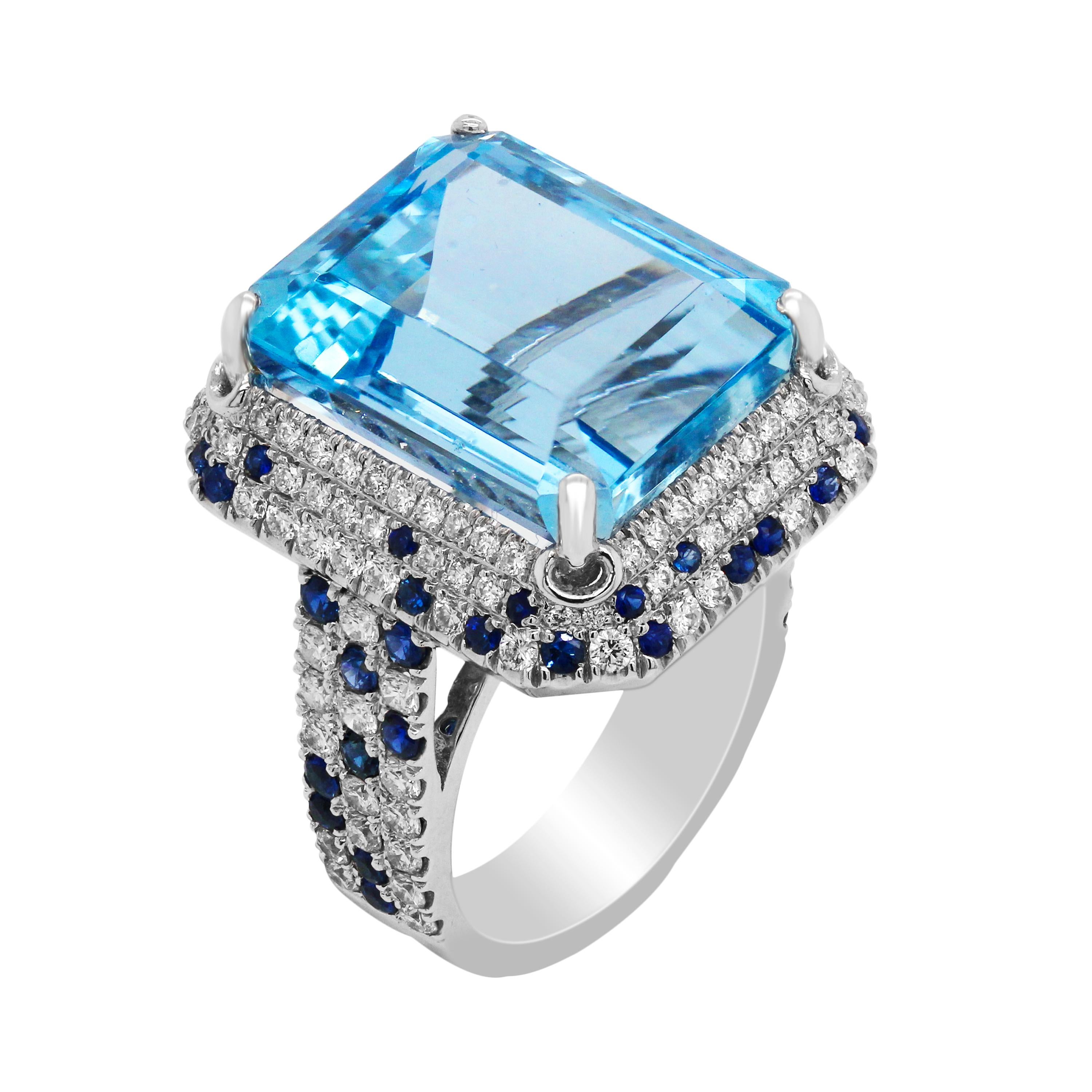 Emerald Cut Aquamarine Blue Sapphire Diamond 18K White Gold Ring

This ring features an excellent quality Aquamarine center, emerald-cut. Ring is done entirely in solid 18K Gold and set with diamonds with touches of blue sapphires all