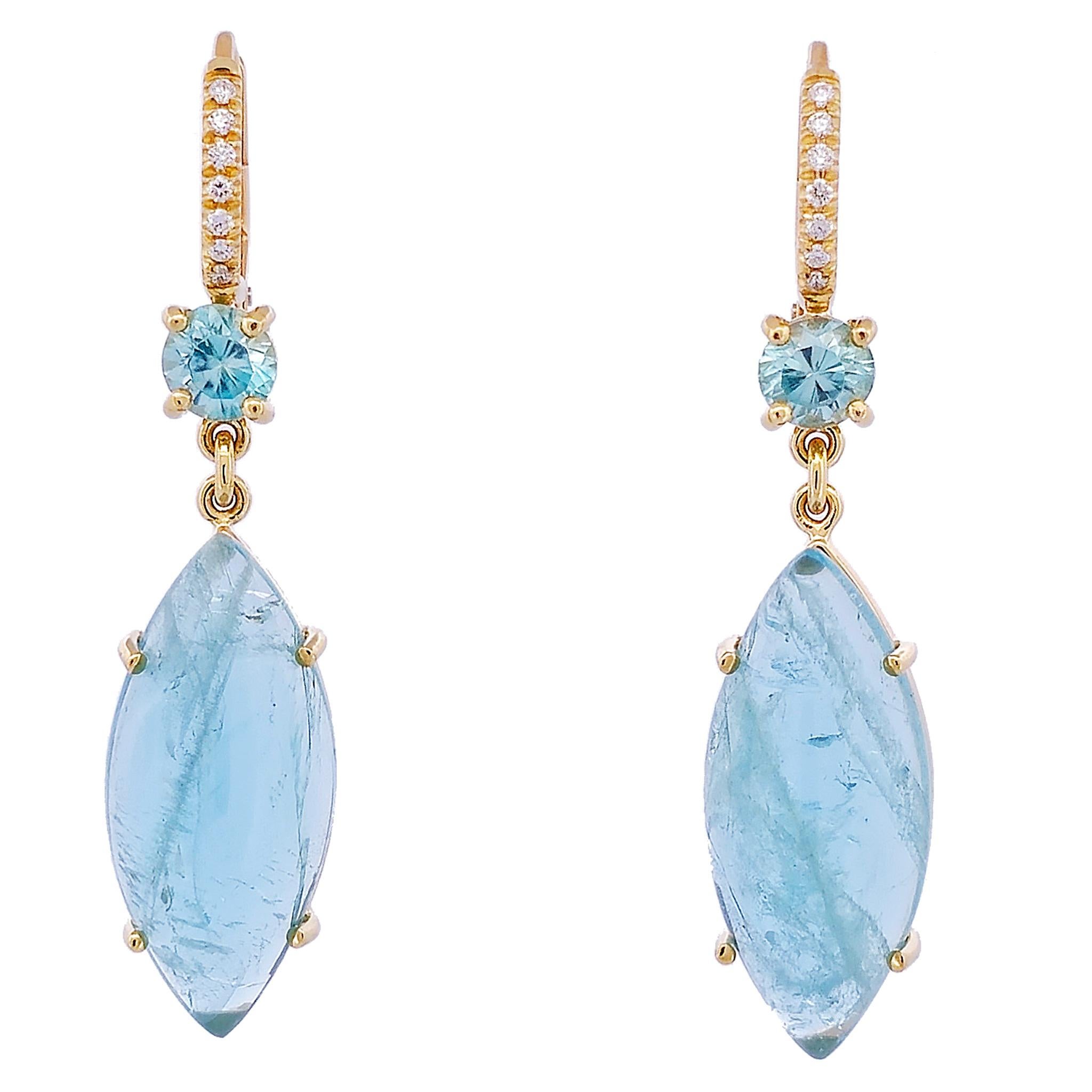 Exquisitely appointed Natural Aquamarine Cabochons Earrings, crafted with marquise cut cabochons in their natural color, feature two prong-set blue zircons weighing a total of 1.65 carats and are graced further by fourteen brilliant F/G VS diamonds,