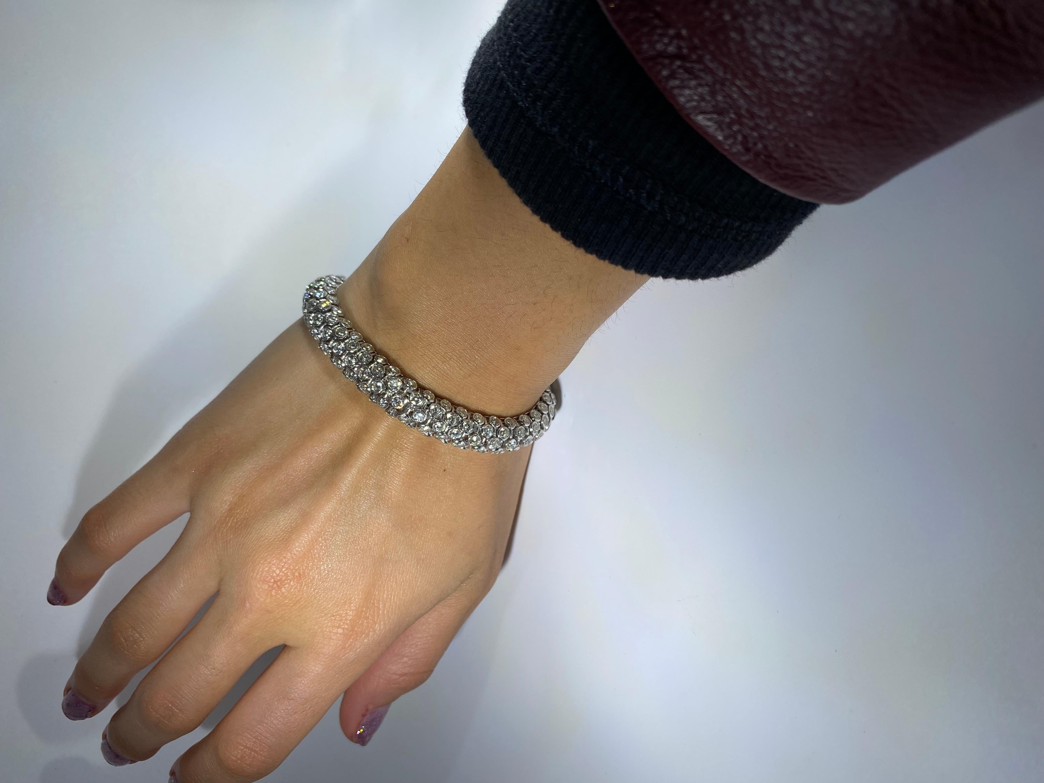Elevate your style with our stunning Serpent Diamond Bracelet, meticulously crafted in 18K white gold. Adorned with a magnificent 16.50-carat array of round brilliant diamonds, this bracelet exudes modern elegance. Its versatile design seamlessly