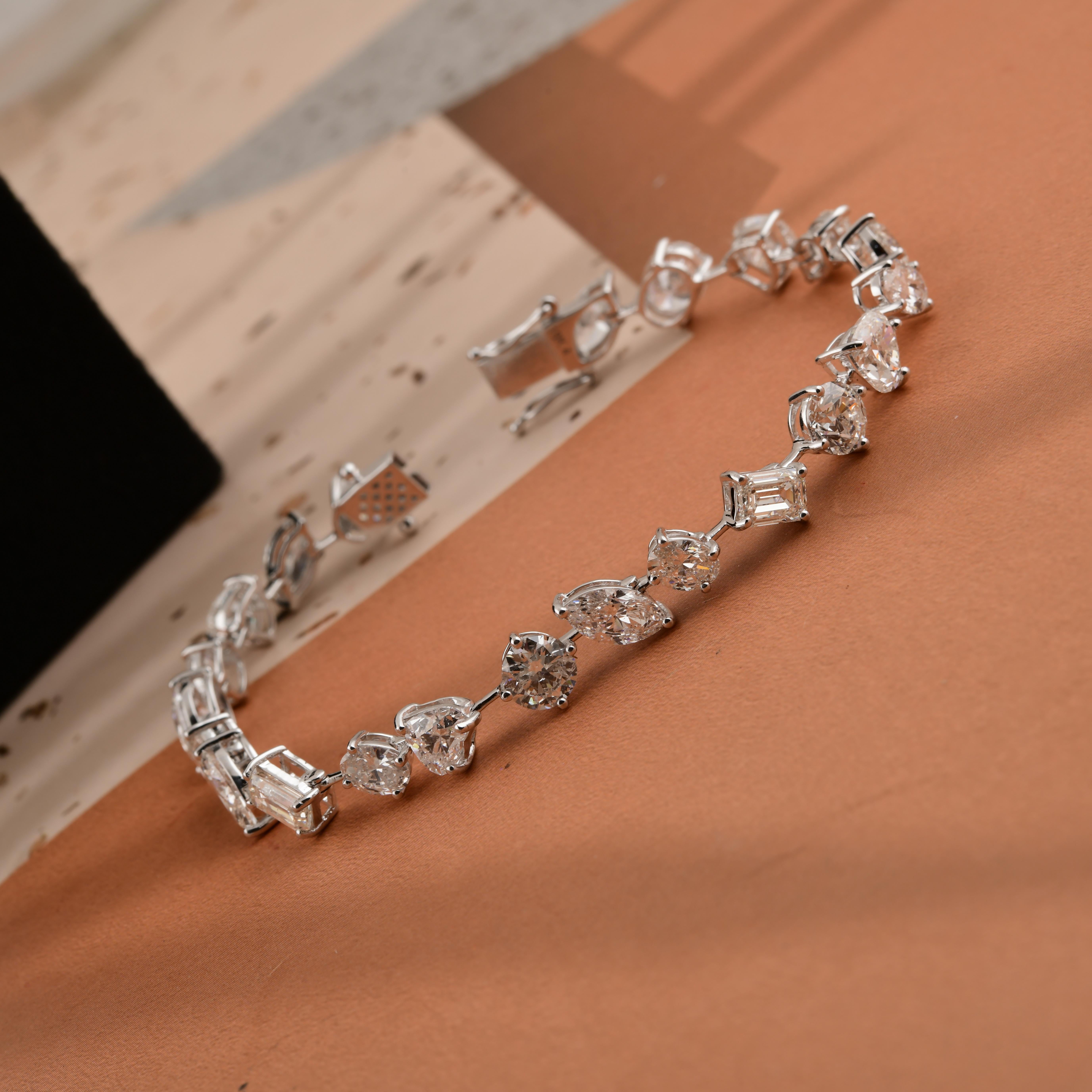 Diamante talla mixta SI/HI de 16,53 quilates Pulsera de tenis de oro blanco de 14 quilates Joyería fina
Este lujoso brazalete de diamantes talla múltiple presenta una mezcla artística de diamantes talla brillante redondo, pera, marquesa y baguette,