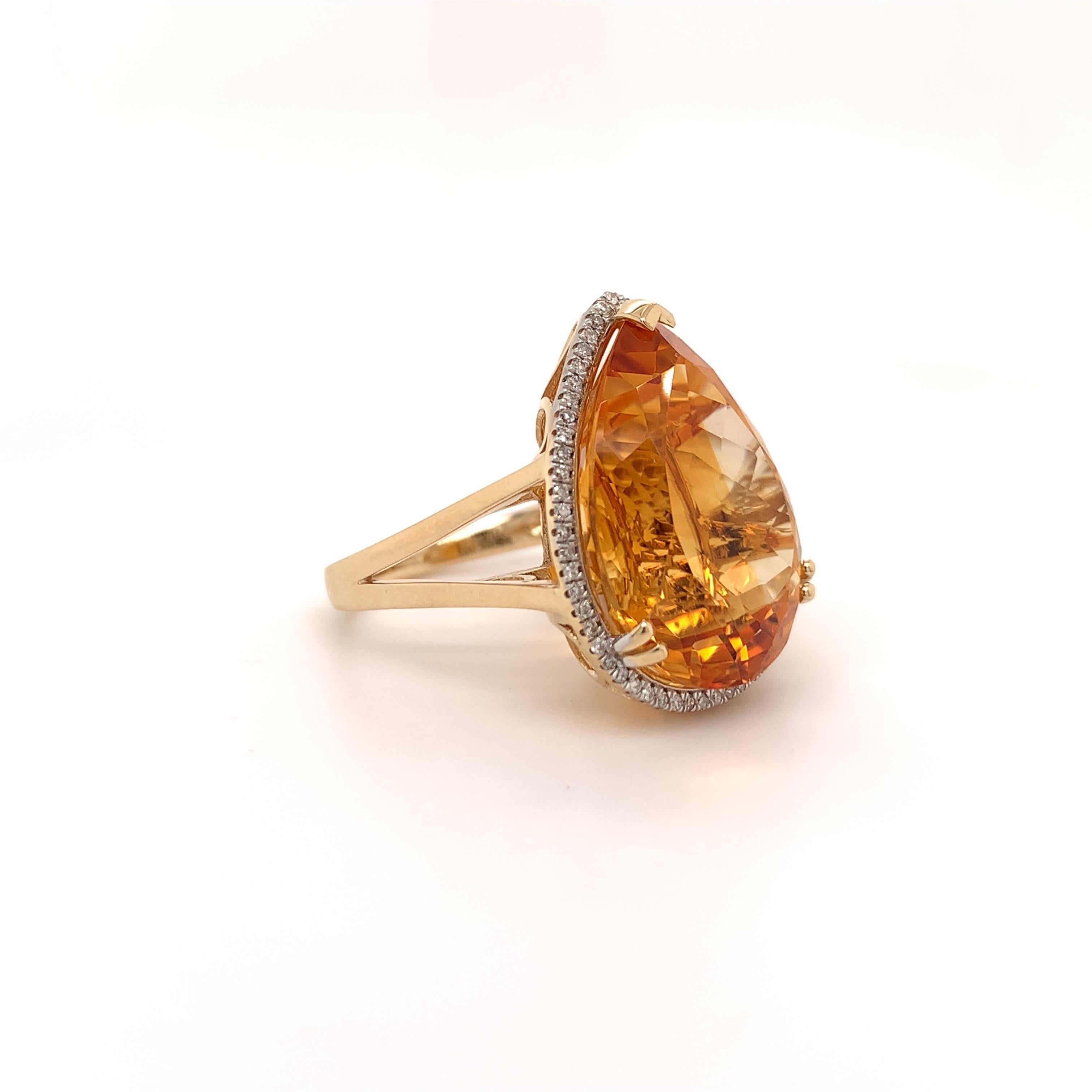 Glamourous citrine diamond cocktail ring. High brilliance, rich golden honey tone, transparent, pear shape faceted, natural 16.54 carats citrine mounted in high profile open basket with 4 bead prongs & 1 knife-edge prong, accented with a round
