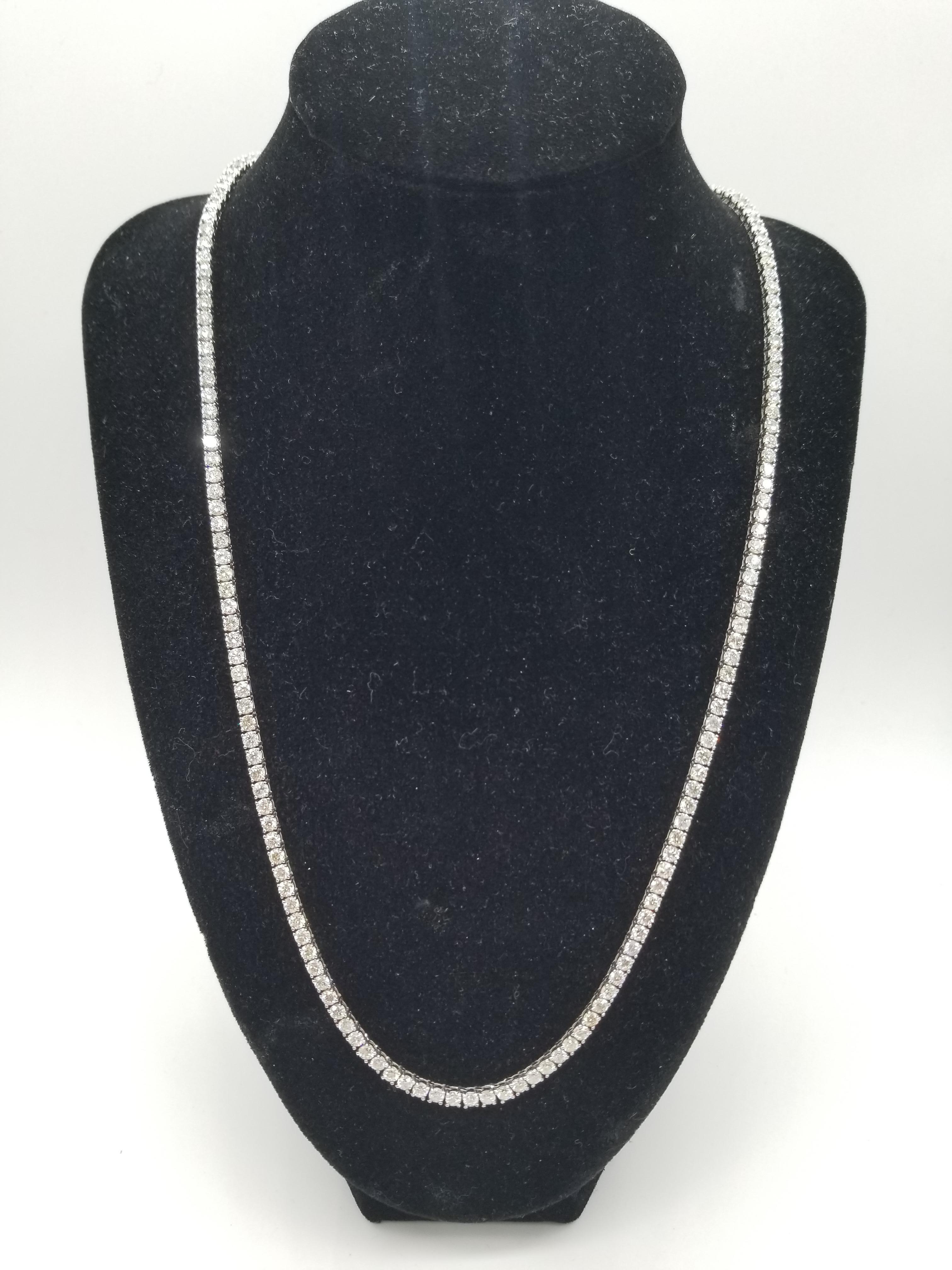 Elegantly simple. Beautiful jewelry 14 Karat White Gold Round Brilliant Cut Diamond Tennis Necklace set on 4 prong setting. The total diamond weight is 16.58 carats. The closure is an insert clasp with safety clasp. Length is 22 inches. Average H-I