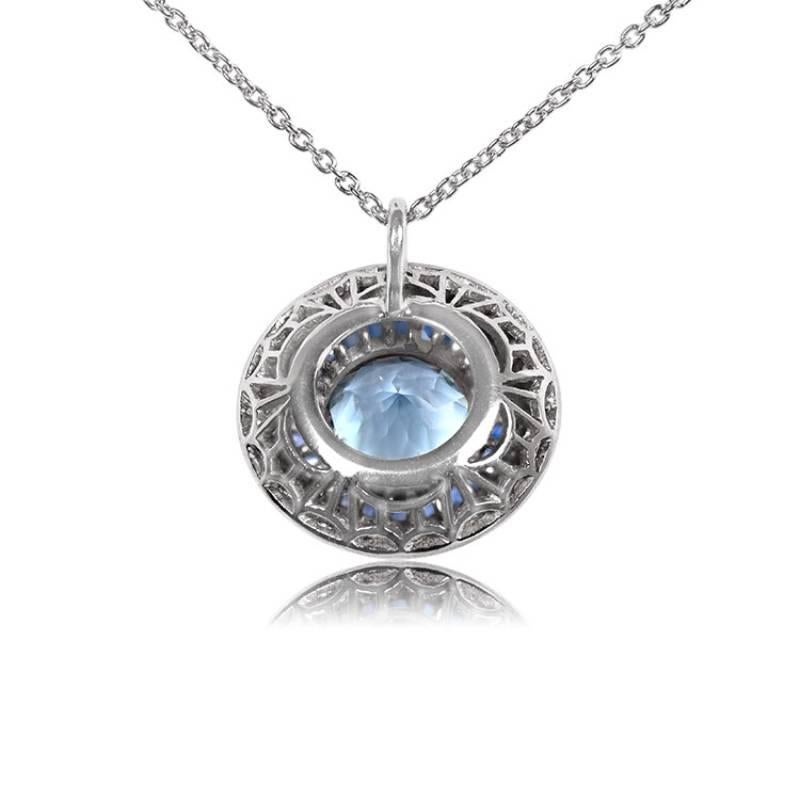 Embrace the allure of the Art Deco era with this exquisite platinum pendant. Handcrafted with meticulous attention to detail, it features a captivating round aquamarine weighing 1.65 carats, elegantly bezel-set at the center.

Surrounding the