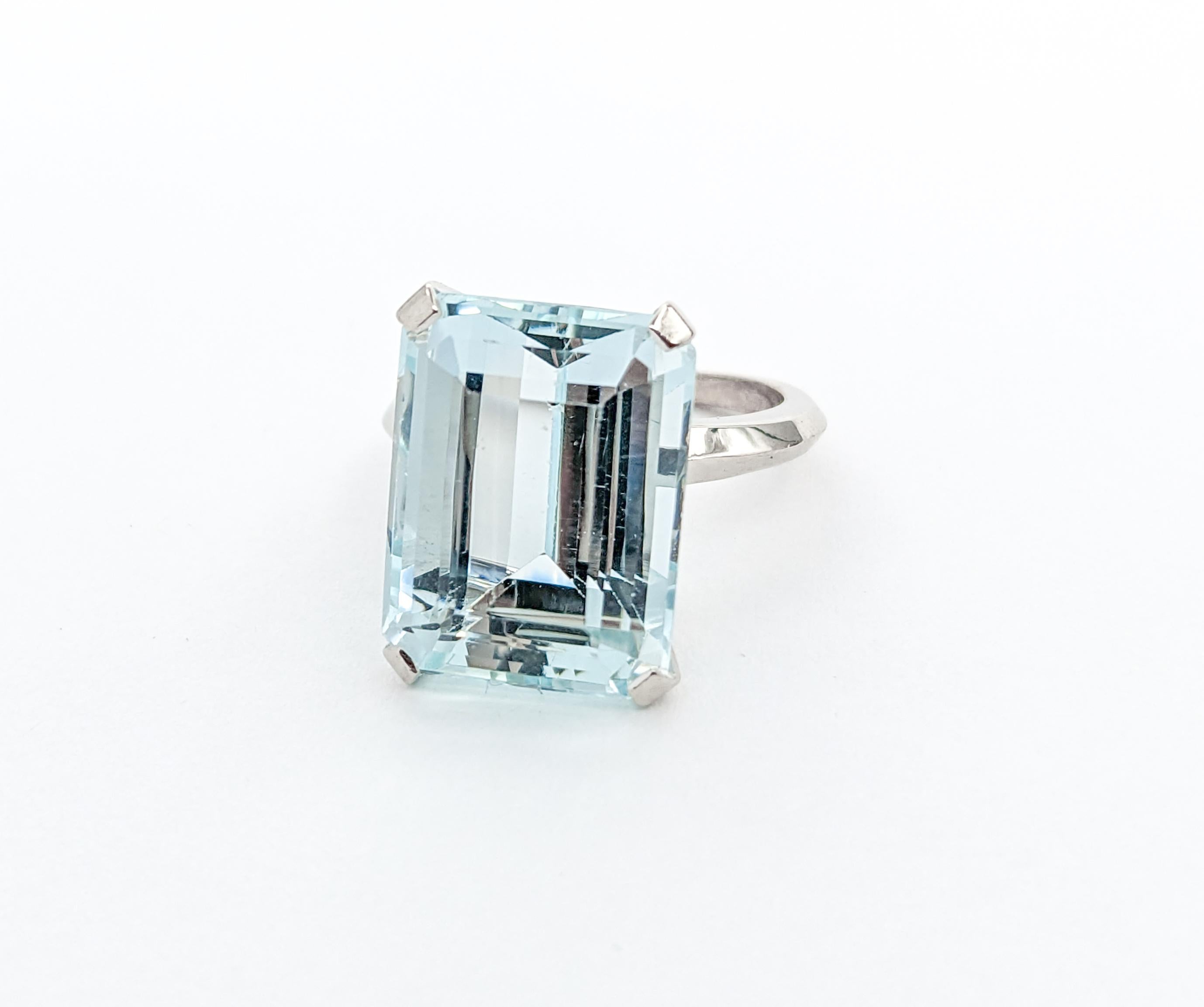 16.5ct Emerald Cut Aquamarine Cocktail Ring In White Gold

Introducing an exquisite Gemstone Cocktail Ring, masterfully crafted in 14k White Gold. This elegant piece showcases a breathtaking 16.5ct Emerald Cut Aquamarine as its centerpiece, set in a