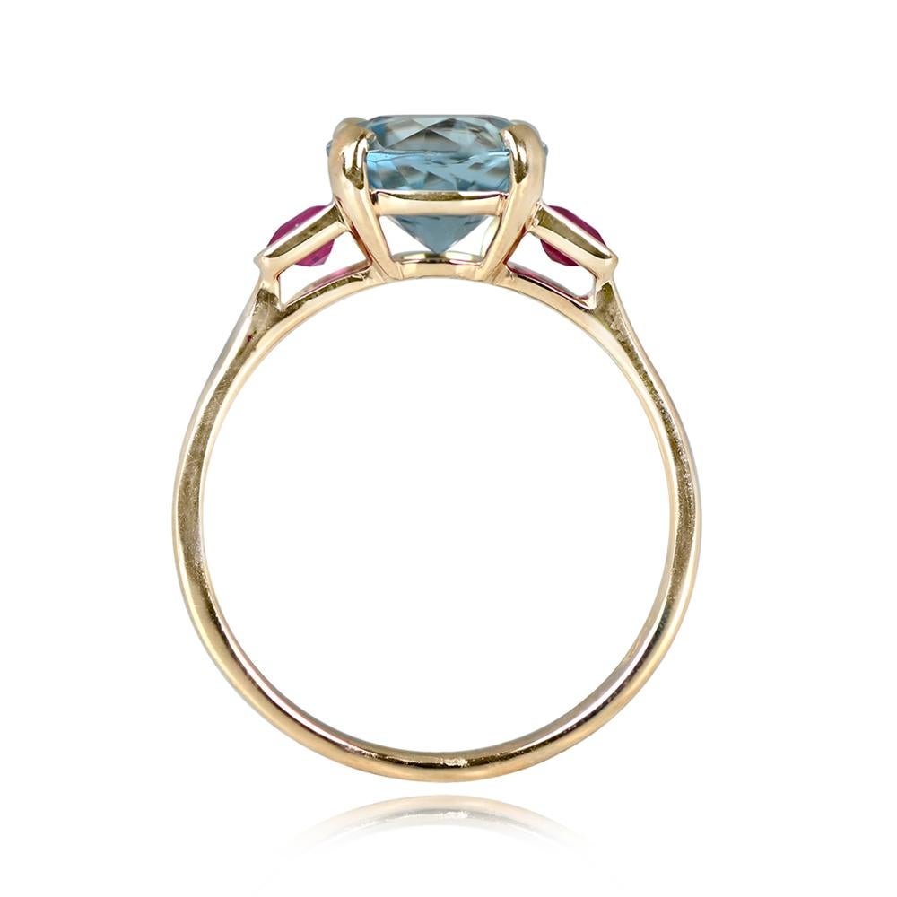A geometric ring with a prong-set 1.65 carat round cut aquamarine center stone. The shoulders are adorned with bezel-set emerald-cut natural rubies. Crafted in 18k yellow gold.


Ring Size: 6.5 US, Resizable
Metal: Gold, Yellow Gold
Stone: