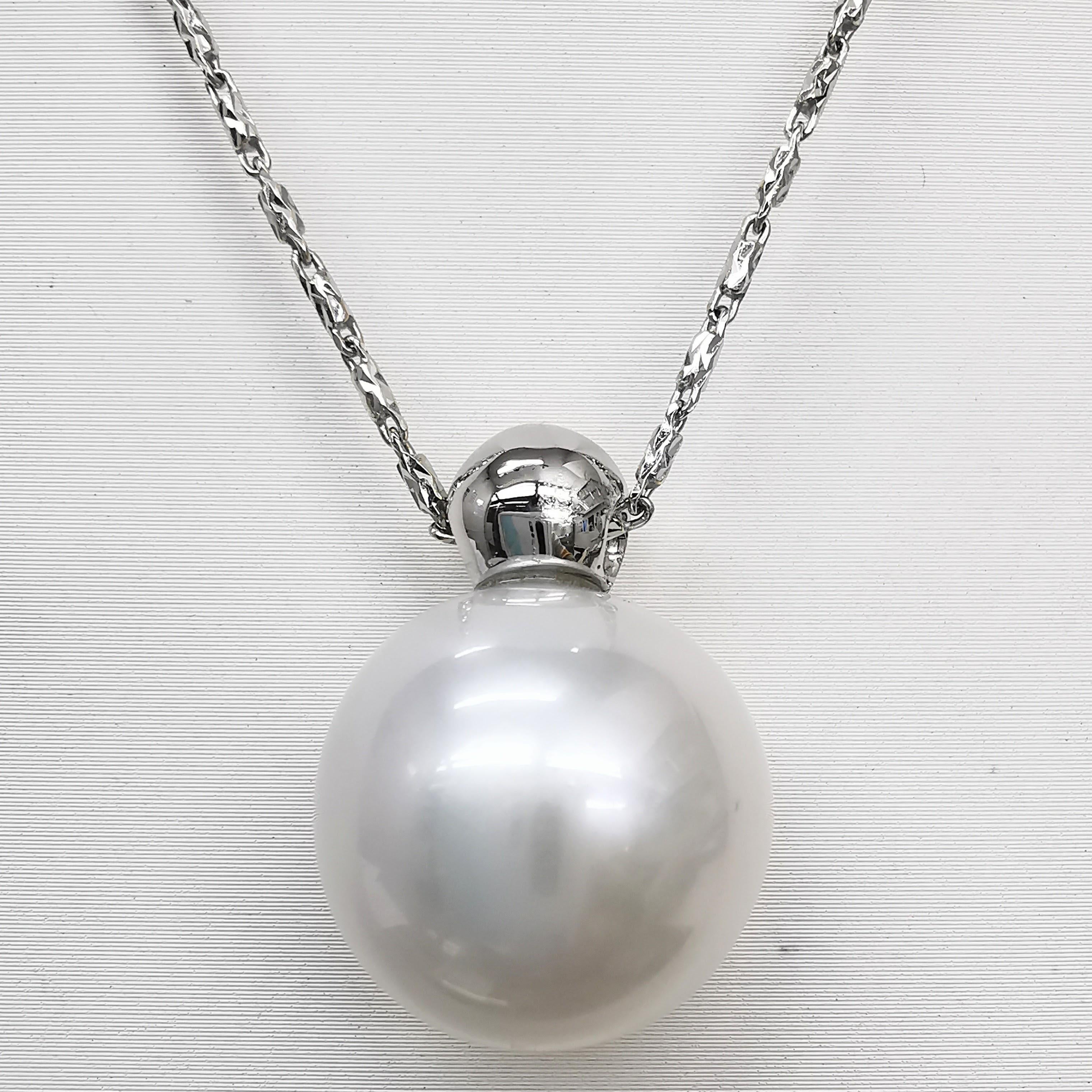 Introduce our beautiful 16.5mm South Sea Pearl Pendant, crafted in 18K white gold. This pendant features a 16.5mm bright white South Sea cultured pearl, known for its high luster, large size and cool white, near silver color. The pearl is