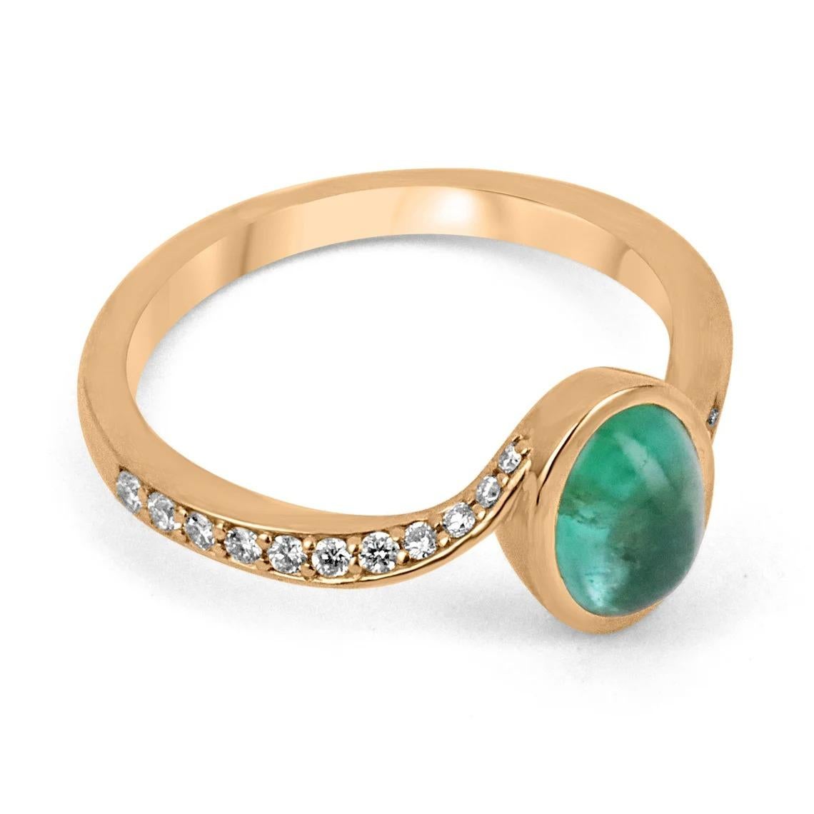 A beautiful, emerald cabochon and diamond accent ring. The center gemstone features a lovely 1.40-carat, natural emerald cabochon cut in an oval shape. Carefully bezel set, with pave set diamonds accenting the bypass shank. Crafted in gleaming 14K