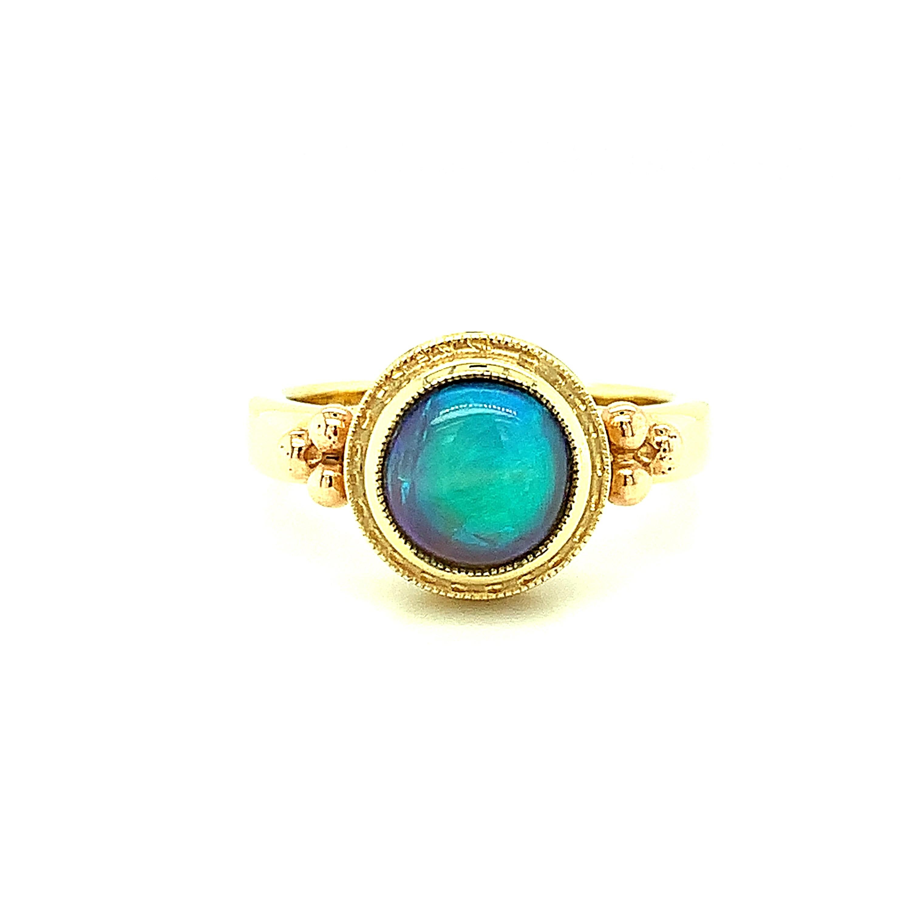 Black opals are rare, especially when they are fine quality like the 1.66 carat black opal in this beautiful custom-designed ring. This opal displays vibrant neon blue and green flashes, also known as 