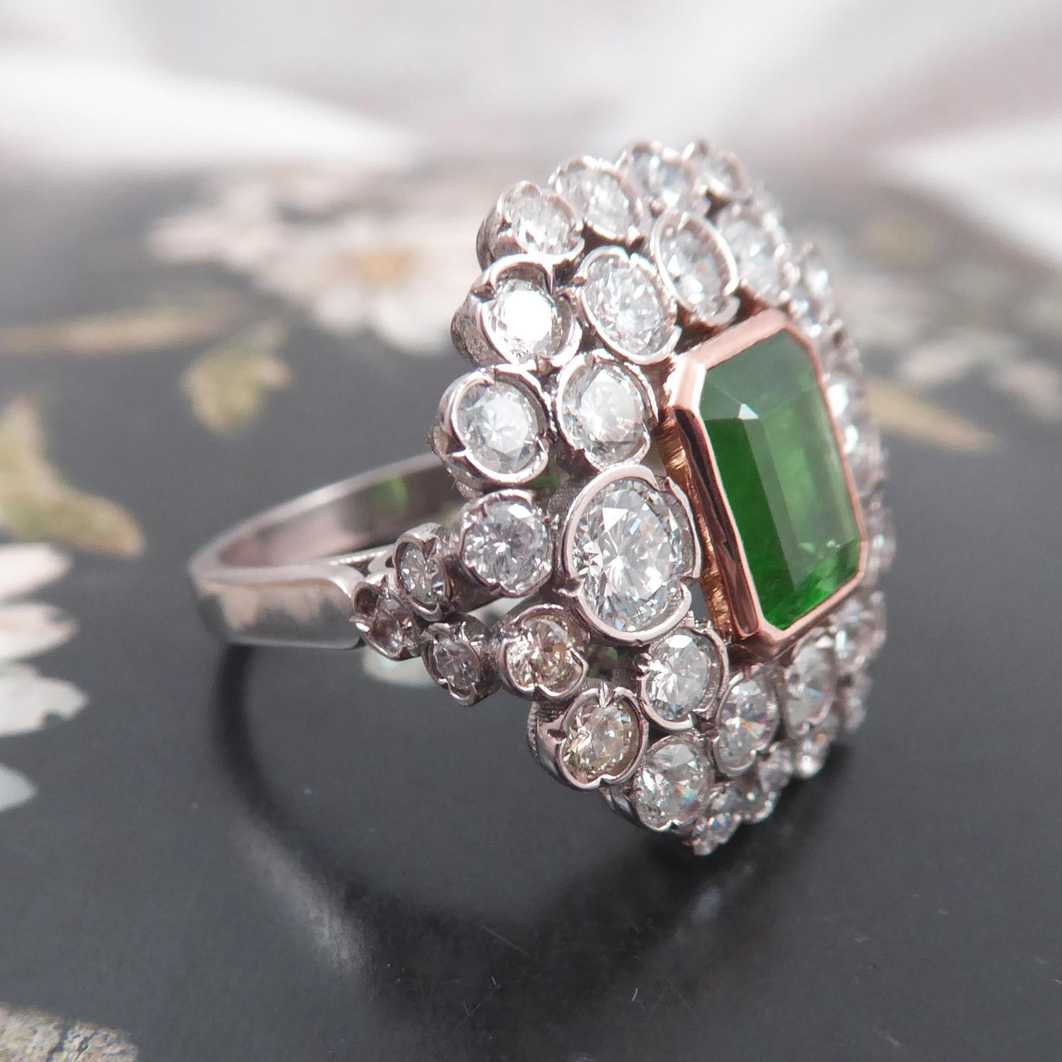 Modern 1.66 Carat Octagonal Step Cut Emerald and 2.93 Carat Diamond Cluster Ring For Sale
