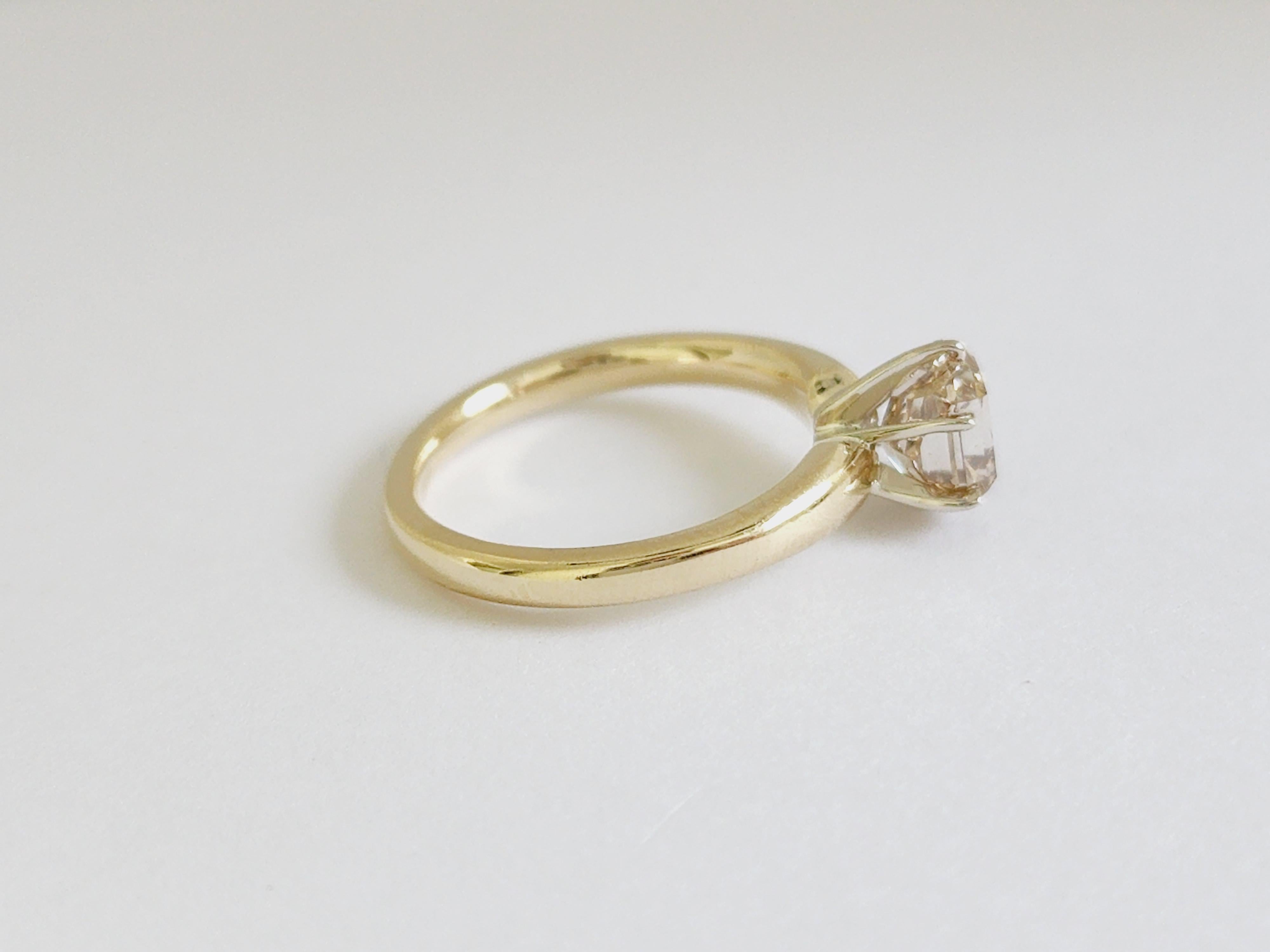 1.66 Carats radiant diamond set on a 6 prong yellow gold 14 Karat solitaire Ring. 
Natural Fancy Brown-Yellow, VS2