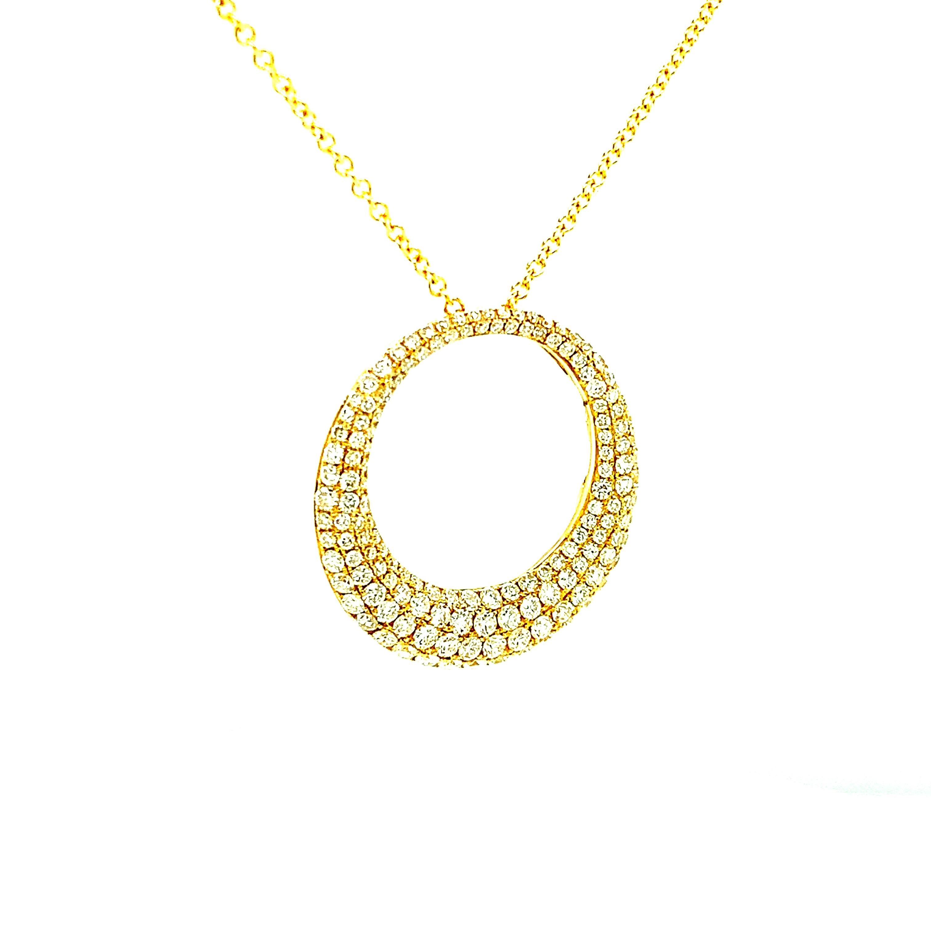 Sparkling white diamonds in graduating sizes and multiple rows are pave set in this chic, 18k yellow gold eternity circle pendant that slides on a beautiful 18k yellow gold link chain. The pendant is wider at the bottom than the top, giving it an