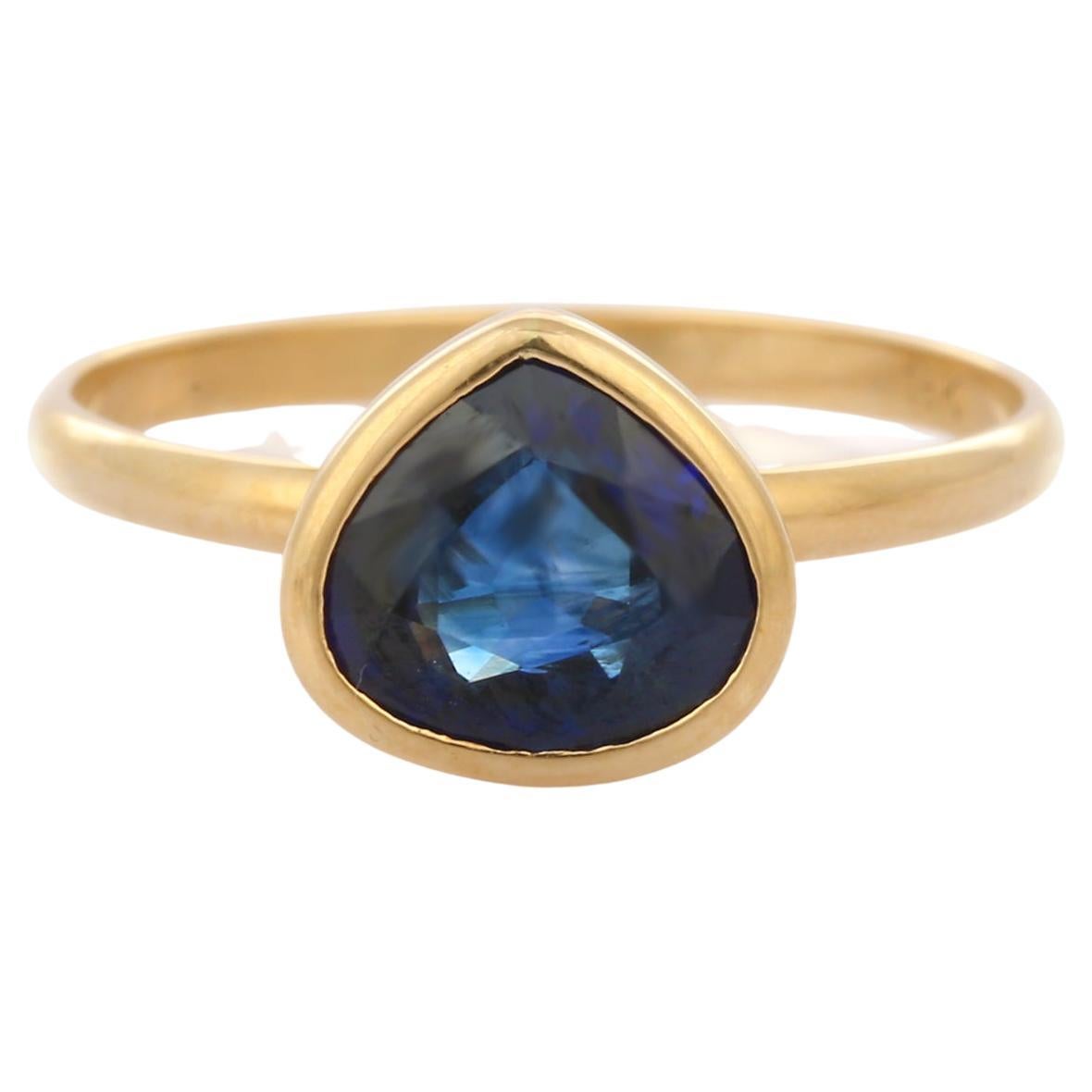 Bague solitaire en or jaune 18 carats avec saphir bleu taille poire de 1,66 carat serti clos