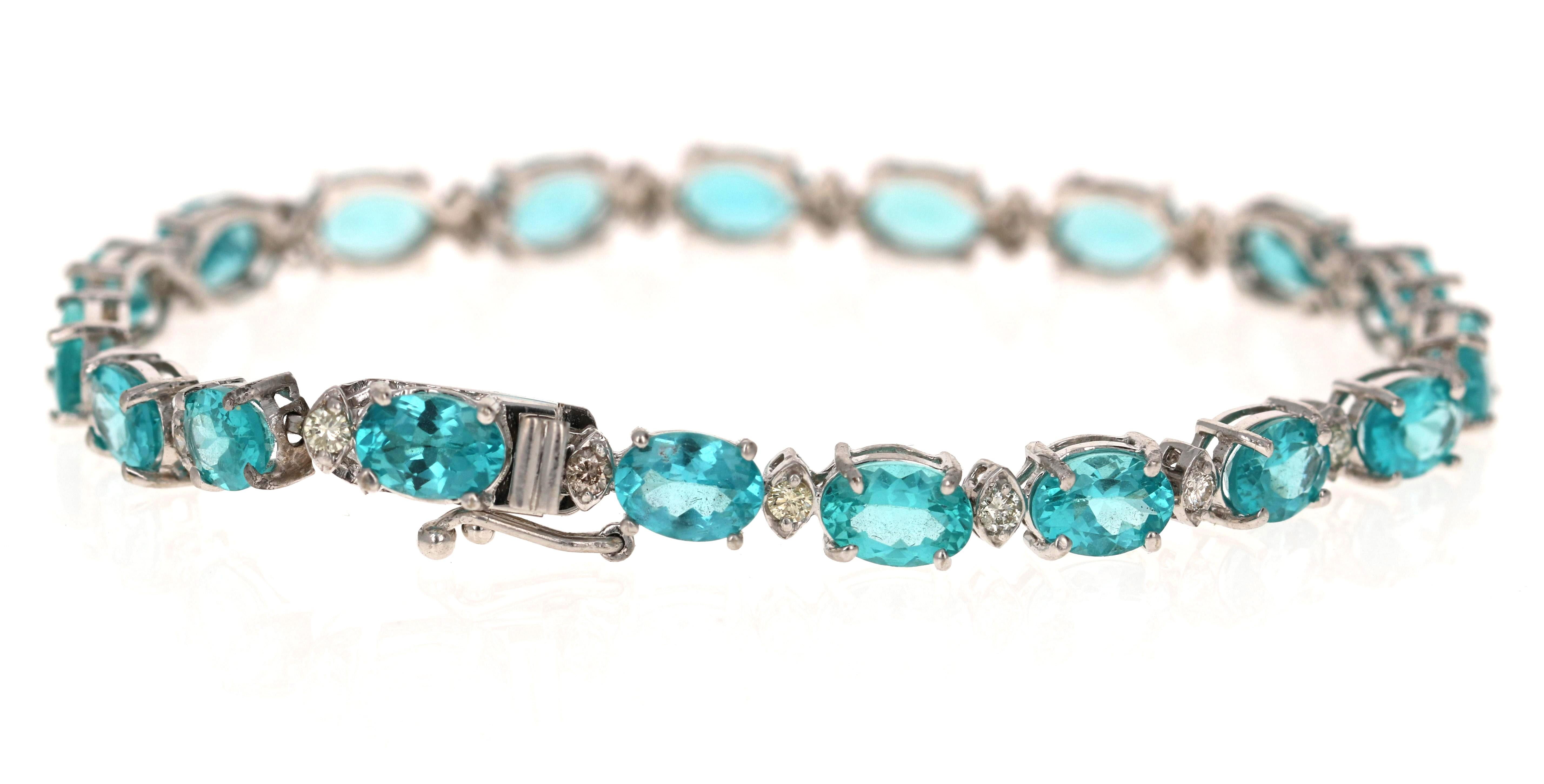 Uniquely designed 16.60 Carat Apatite Diamond White Gold Tennis Bracelet. This gorgeous piece has 19 Oval Cut Apatites that weigh a total of 15.81 Carats and 19 Round Cut Diamonds that weigh 0.79 carats. It is casted in 14K and weighs approximately