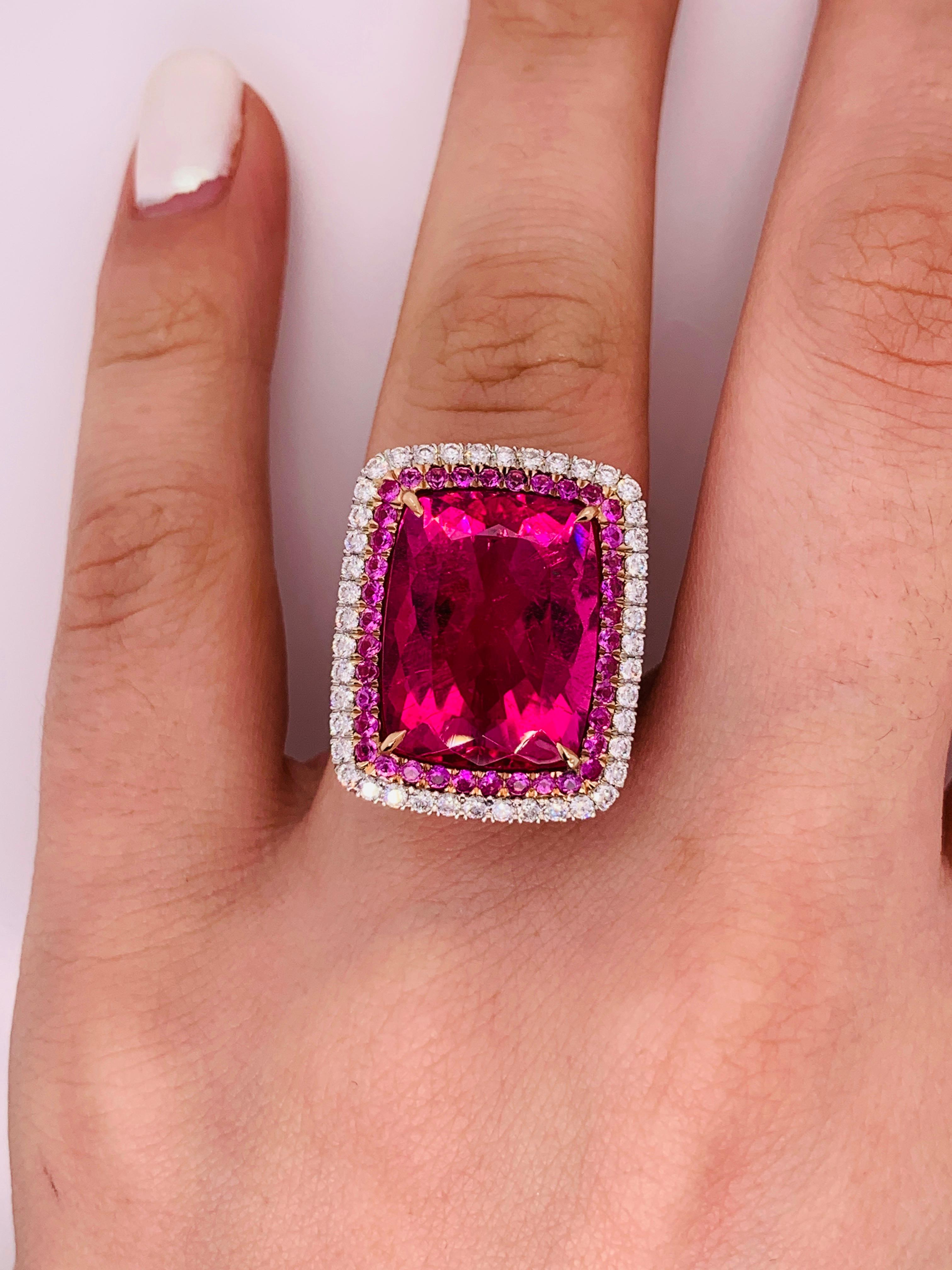 Stunning Pink Tourmaline and Diamond Ring in white gold
The center stone is 16.60 Carats Pink Tourmaline, surrounded by 0.80 carats of small pink tourmalines  and 1.50 carats of white brilliant cut diamonds. 
