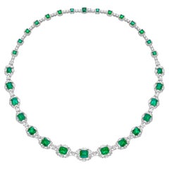 16.63 Carat Emerald Necklace in 18KWYG with White Diamond.