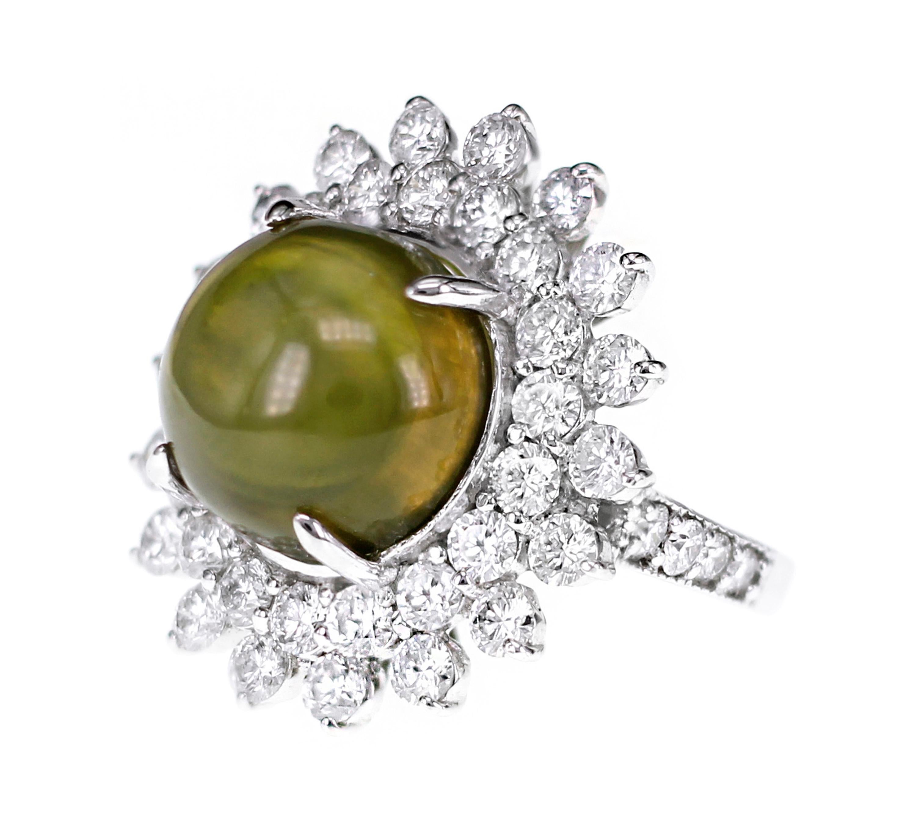 A  GIA certified 16.67 Chrysoberyl Cats Eye is set in a neo classical ring with 3.00 carats of White brilliant round diamond. 
The ring size is US 6