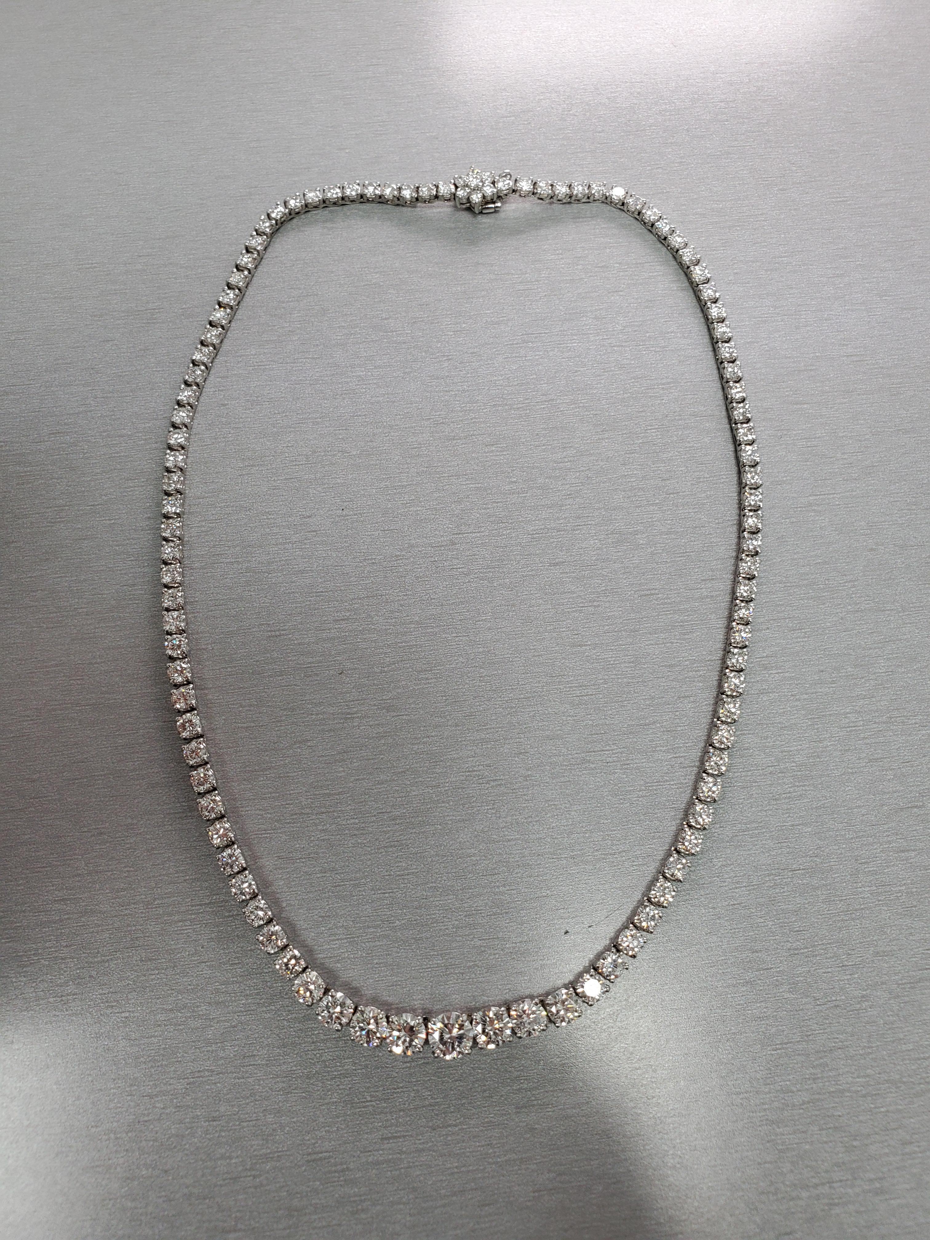 16 Inch Diamond Riviera necklace. Set in Platinum. Average Diamond color is G and average Diamond clarity is VS. Center Diamond weights 1.02 carats. 16.68 carats total. Flower Design around the lock to hide the clasp. 