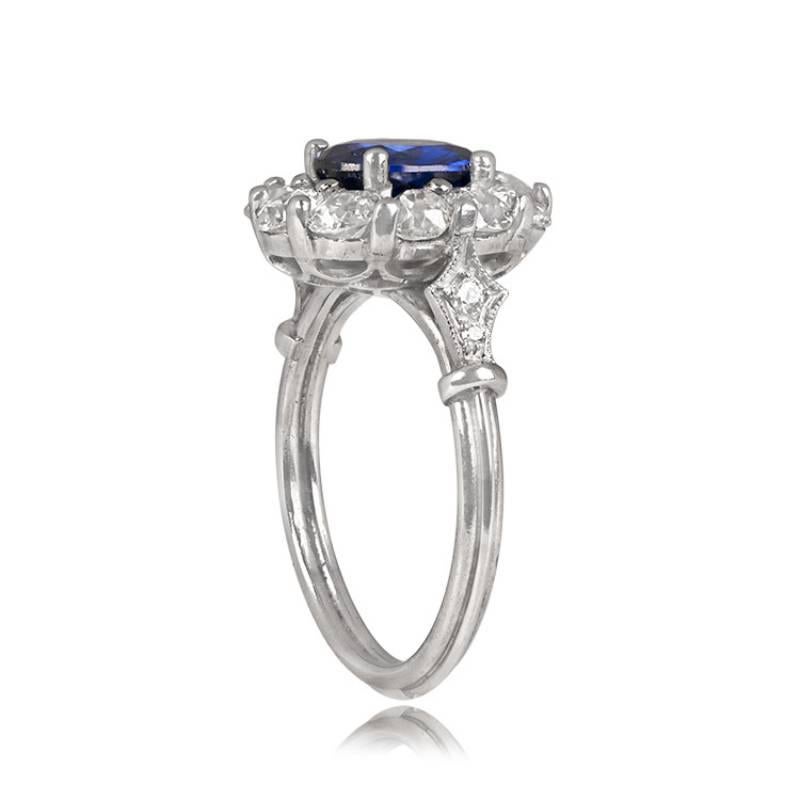 1.66ct Blue Oval Cut Sapphire Cluster Ring, Floral Diamond Halo, Platinum In Excellent Condition In New York, NY