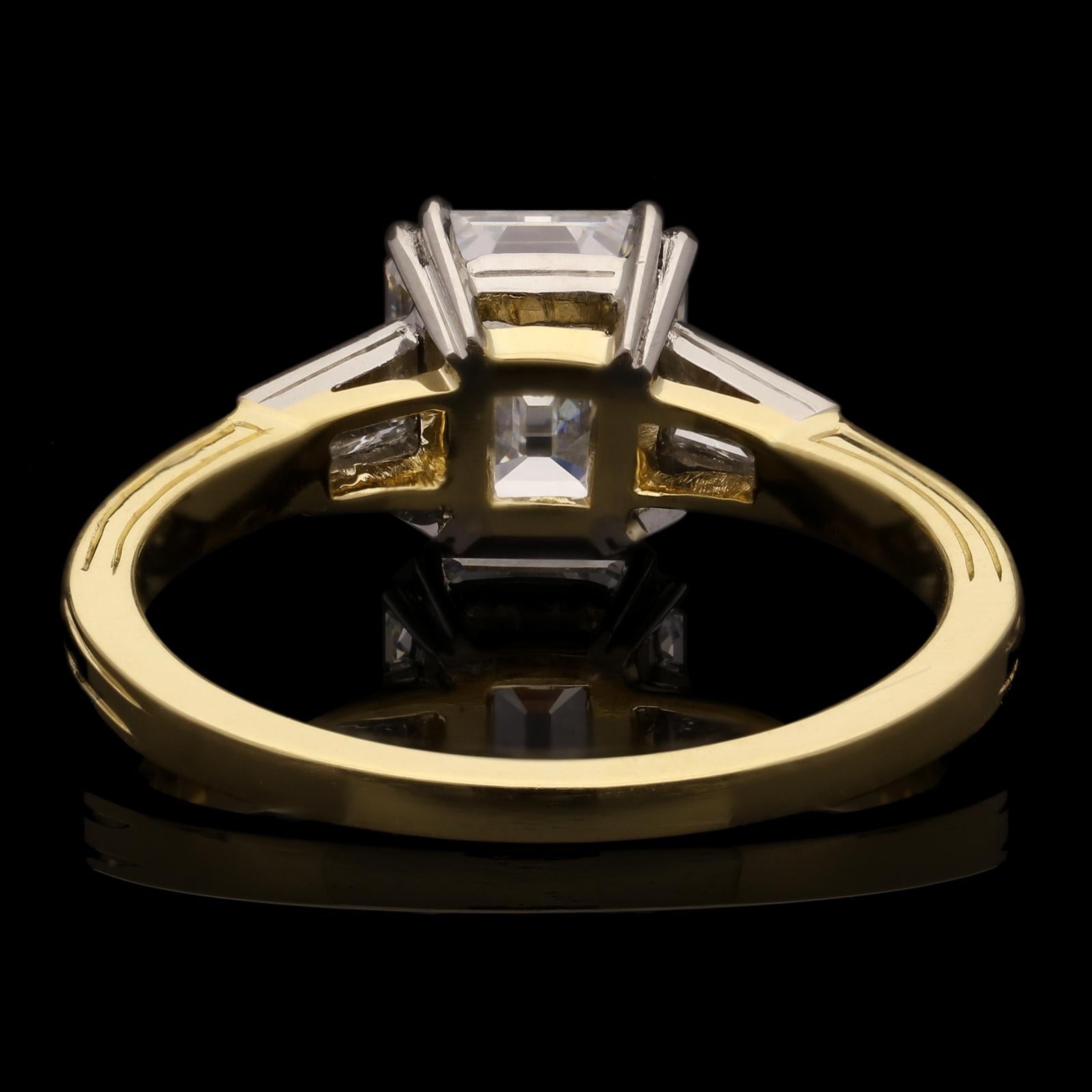 A beautiful vintage emerald-cut diamond ring by Hancocks set with a finest quality vintage emerald-cut diamond weighing 1.66ct and of D colour and Internally Flawless clarity, corner claw set between tapered baguette diamond-set shoulders all in