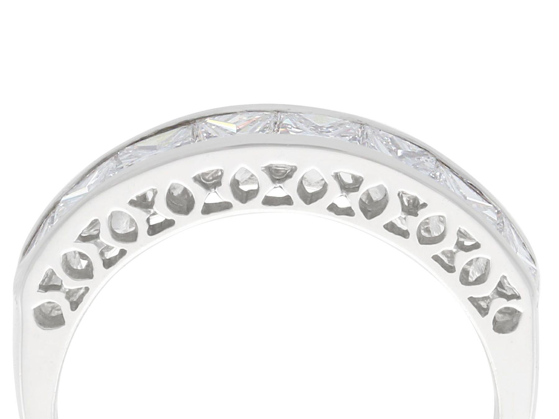 A stunning, fine and impressive contemporary 1.66 carat diamond and platinum half eternity ring; part of our diverse diamond jewelry and estate jewelry collections.

This stunning, fine and impressive contemporary eternity band has been crafted in