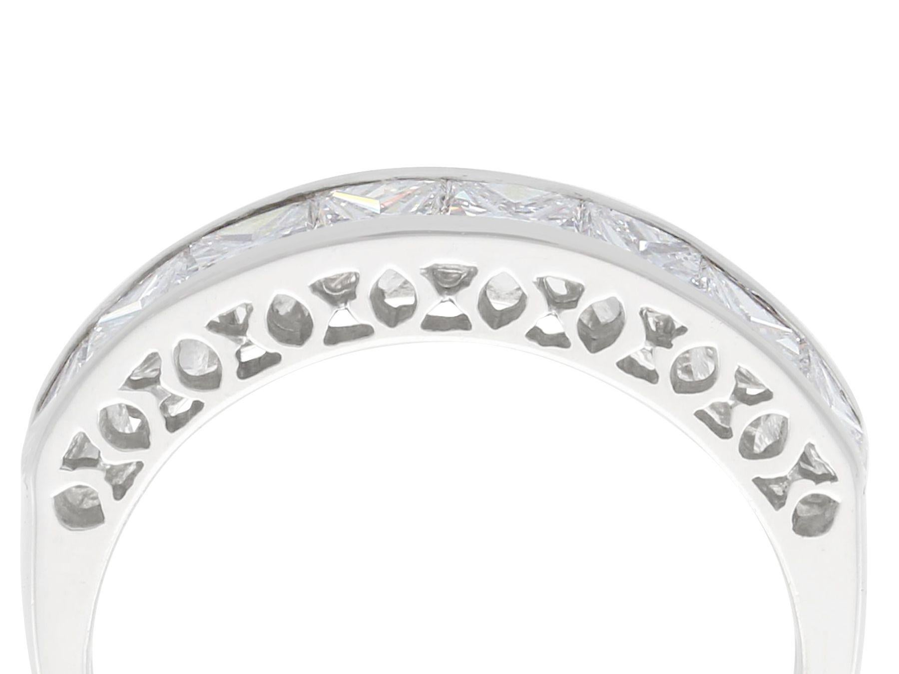 A stunning, fine and impressive contemporary 1.66 carat diamond and platinum half eternity ring; part of our diverse diamond jewelry and estate jewelry collections.

This stunning, fine and impressive contemporary eternity band has been crafted in