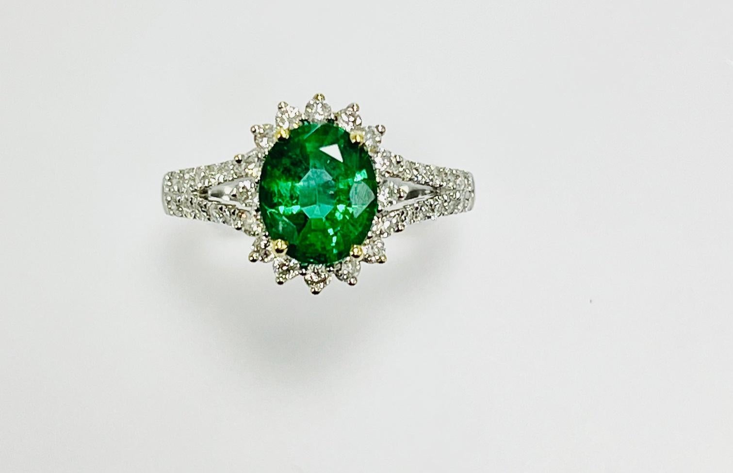 1.67 Carat Oval shape zambian emerald set In 18k white gold ring , yellow basket ,  with 0.60 carat Diamond around it and half way on the split shank .650