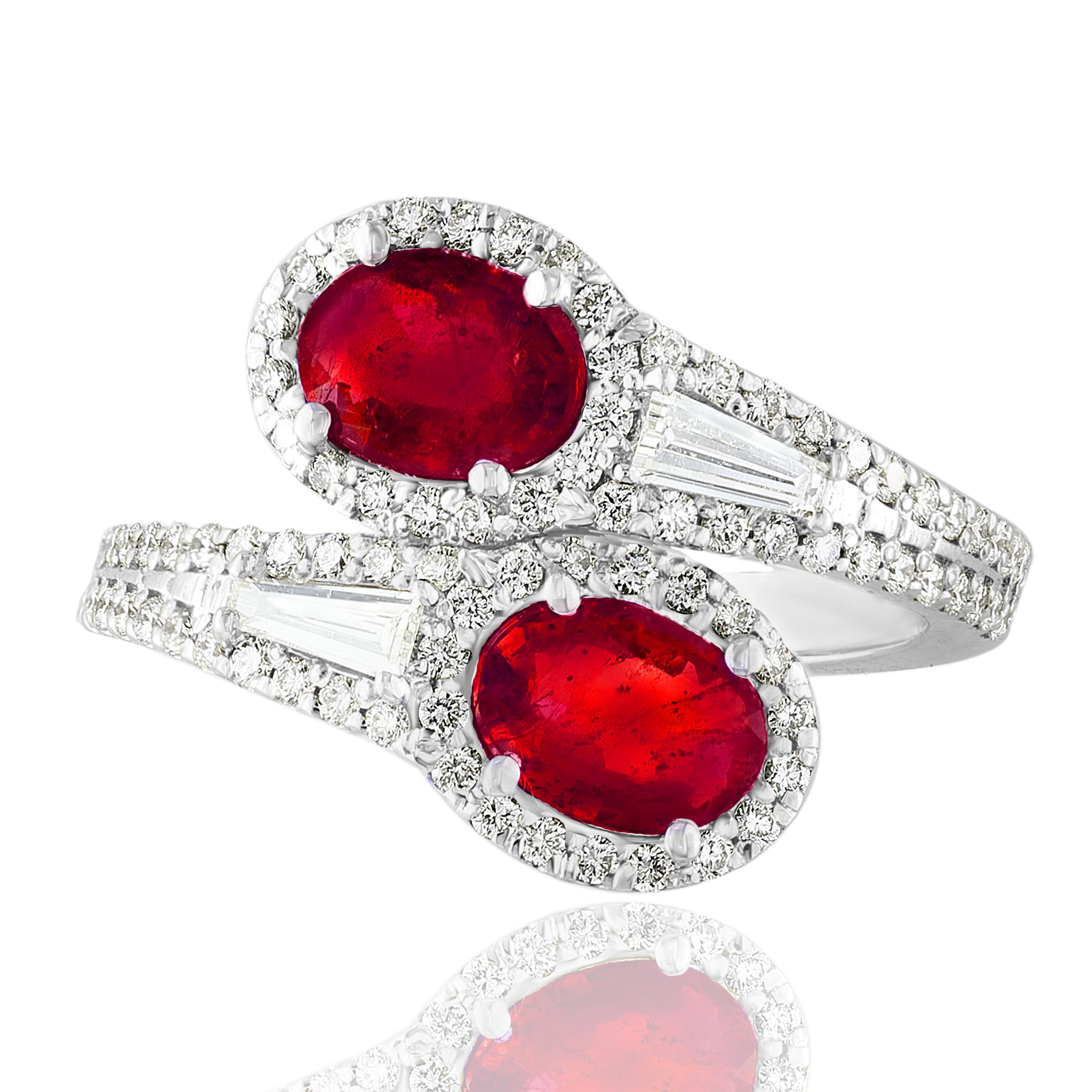 The stunning forever-together Toi et Moi ring features 2 Oval cut Rubies embraced by east to west 2 baguette diamonds weigh and 84 round diamonds halfway to the shank. Handcrafted in 14k White Gold.
2 oval Rubies in the center weigh 1.67 carats and