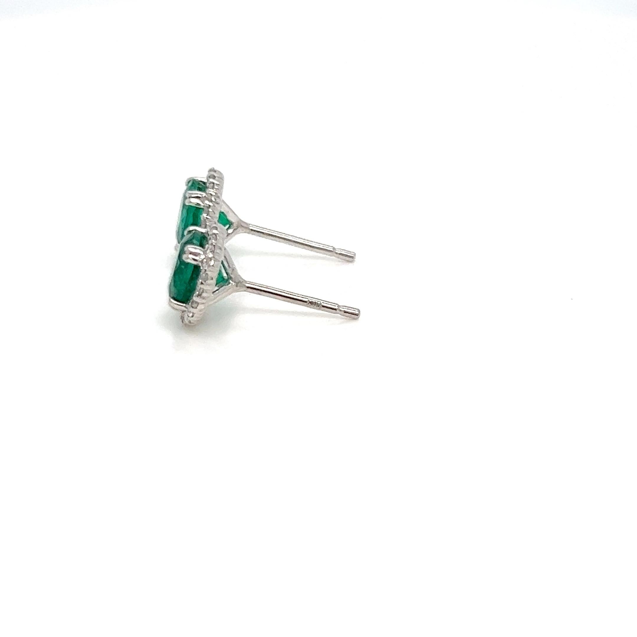 Dwell into this beautiful 1.67 carats emerald and diamond stud earrings made in 18k white gold. Emeralds are one of the most precious gemstones on earth and rare to find so extreme care is necessary. The emeralds and diamonds used are hand picked