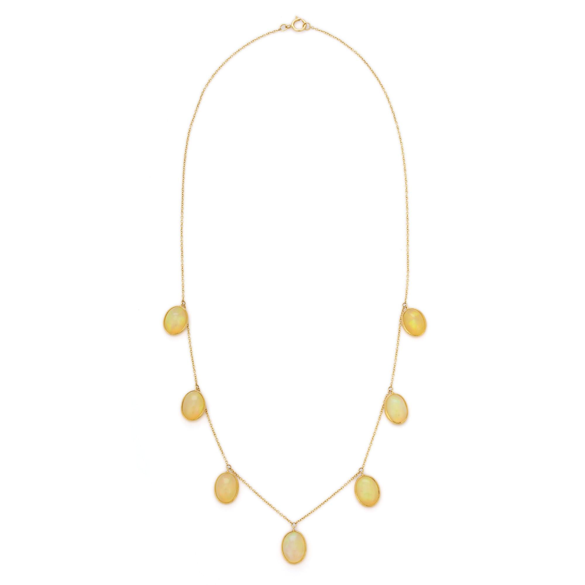 Opal Charm Necklace in 18K Gold studded with oval cut opal.
Accessorize your look with this elegant opal charm necklace. This stunning piece of jewelry instantly elevates a casual look or dressy outfit. Comfortable and easy to wear, it is just as