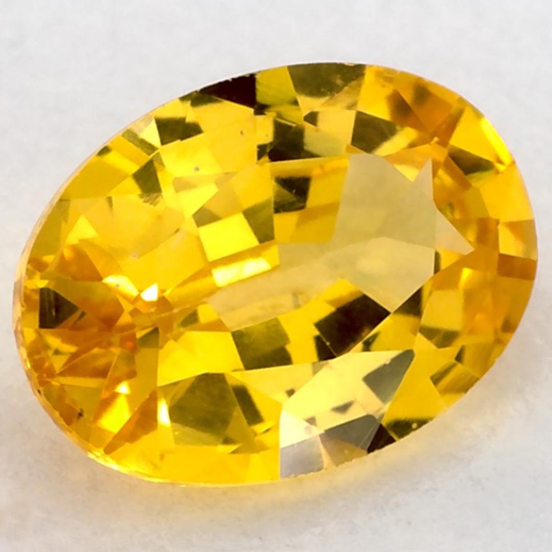 This natural Yellow sapphire offers elegance and sophistication. With its rich color saturation and precise cutting, it is the perfect centerpiece for an engagement ring or luxury jewelry design.

This sapphire originates from Sri Lanka (Ceylon),